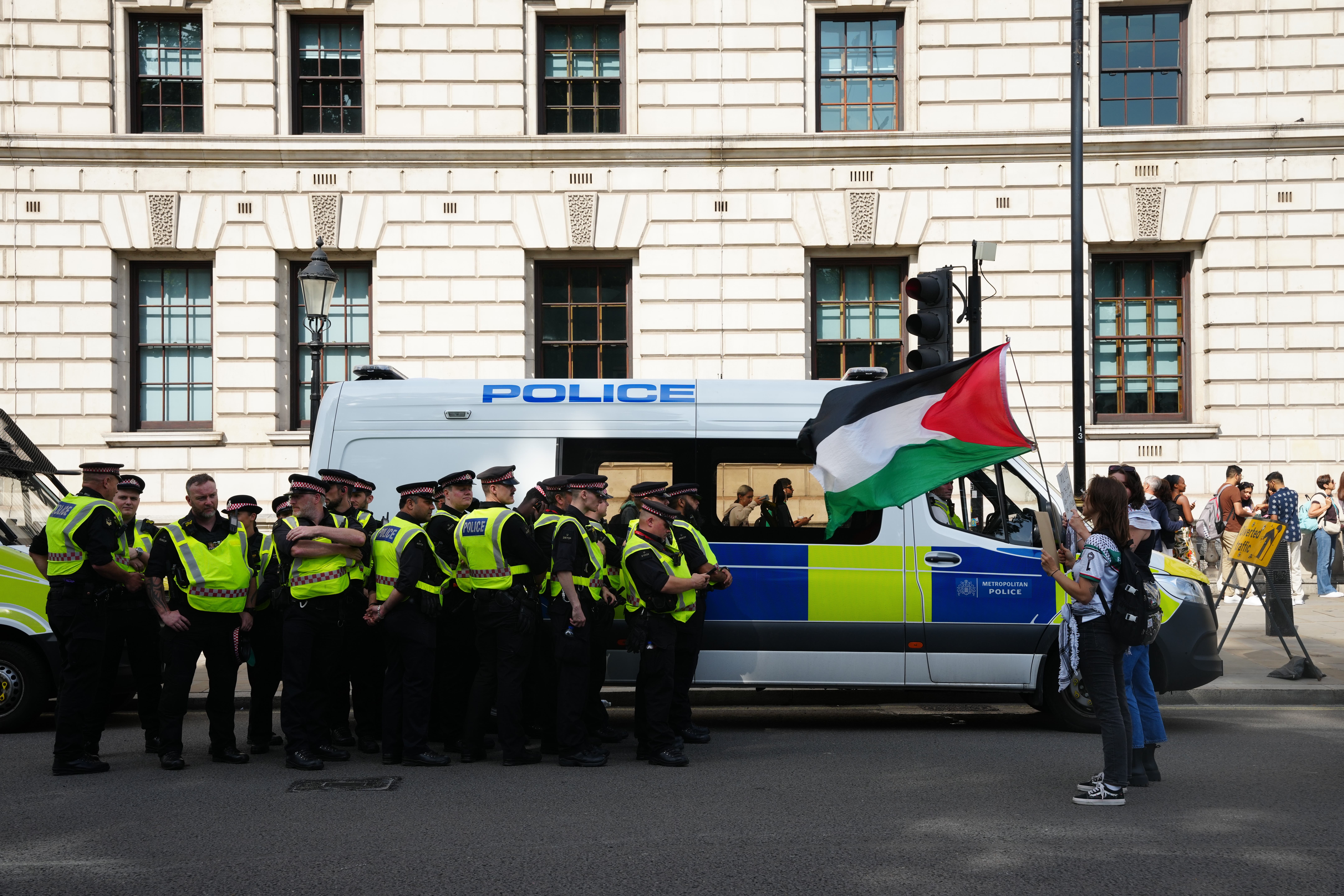 Police officers and demonstrators during a Lift the Ban on Palestine Action protest earlier in September