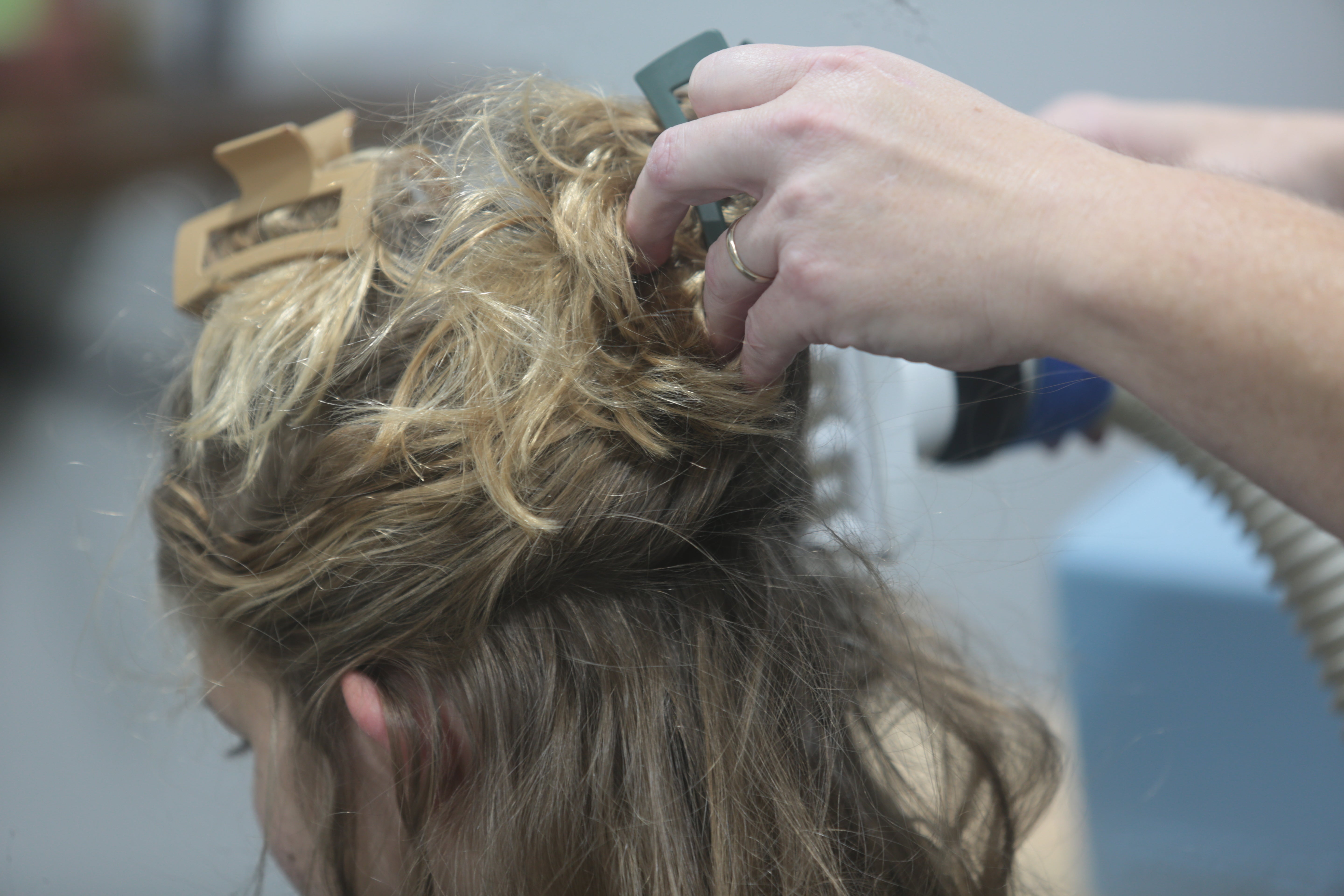 A client at Lice Clinics of America in Sugar Land, Texas