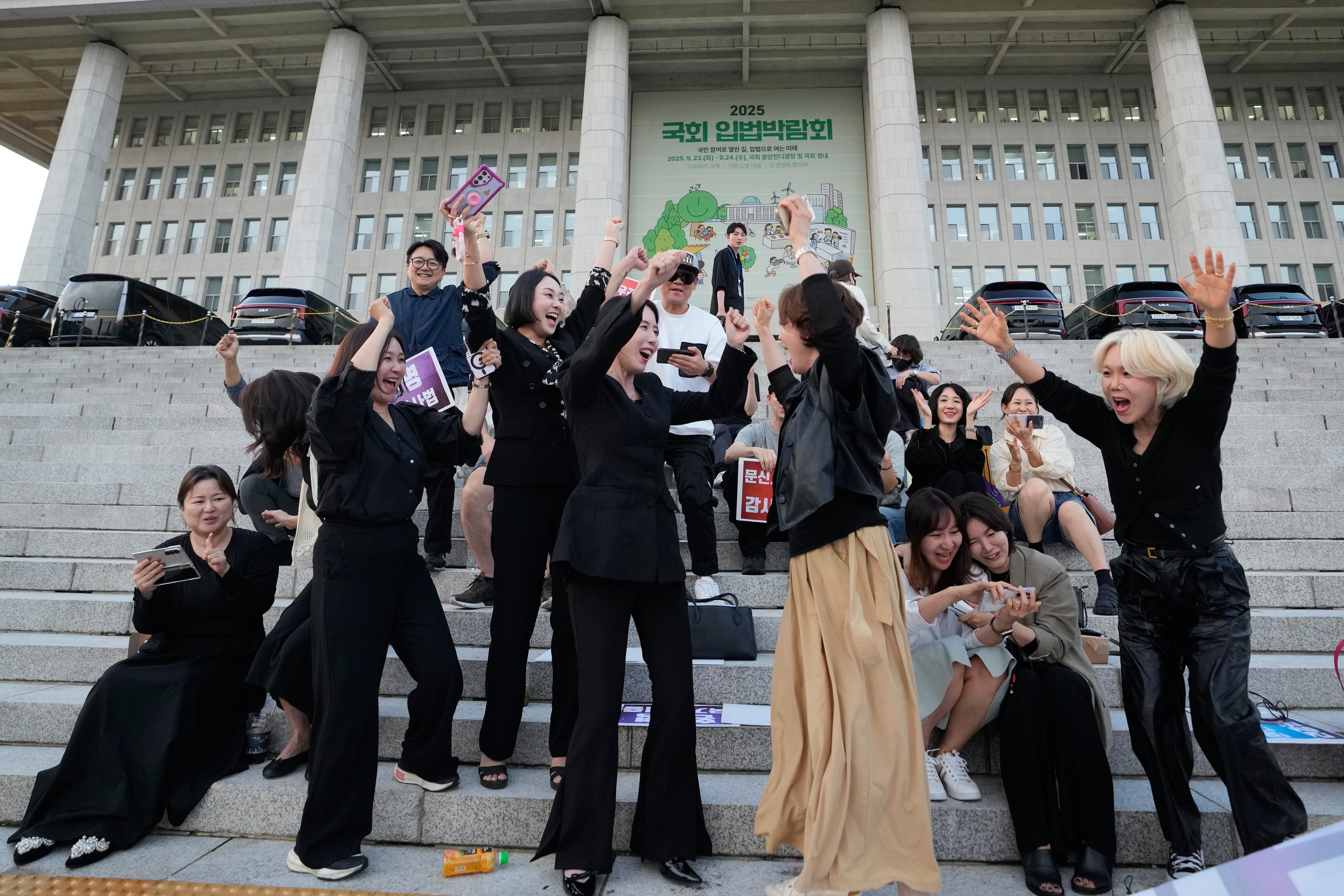 <p>Members of the Korea Tattoo Federation celebrate after hearing the news that parliament passed a bill that would allow non-medical personnel to give tattoos outside the National Assembly, in Seoul</p>