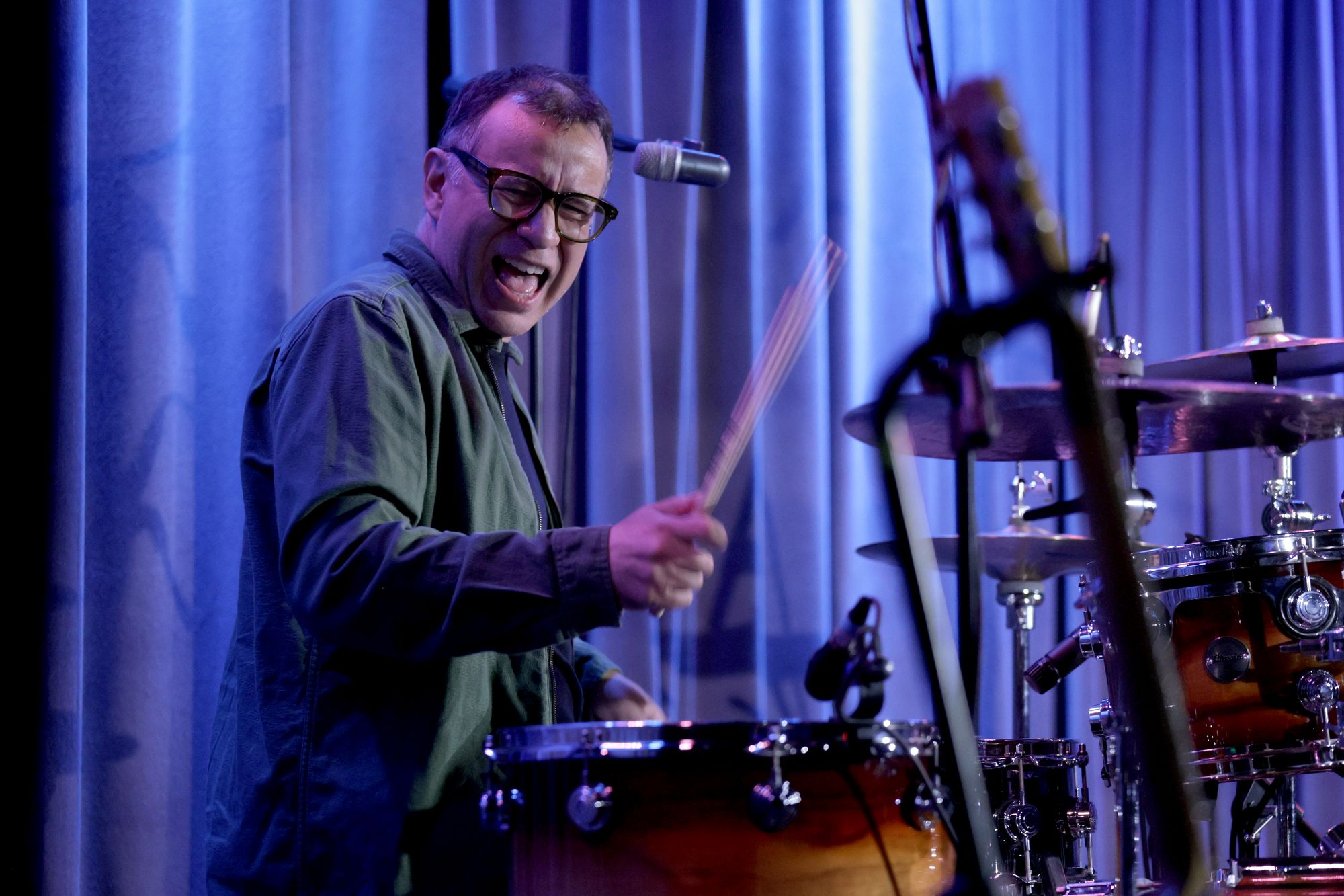On the skins: Armisen playing drums with Bob Mould in August 2025