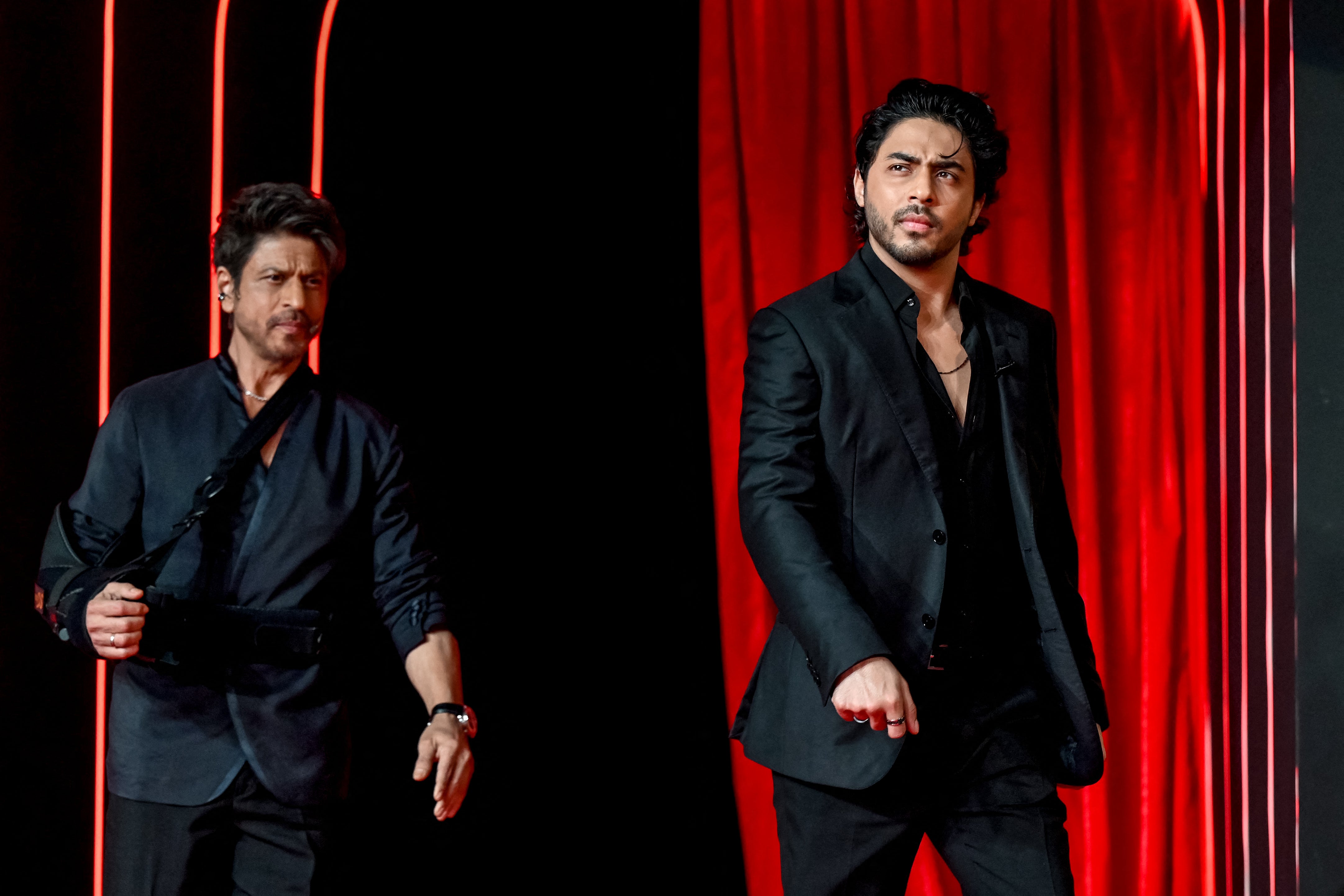 Bollywood actor Shah Rukh Khan and his son Aryan Khan (right) arrive to the preview of his son's directorial debut, 'The Ba***ds of Bollywood' in Mumbai;