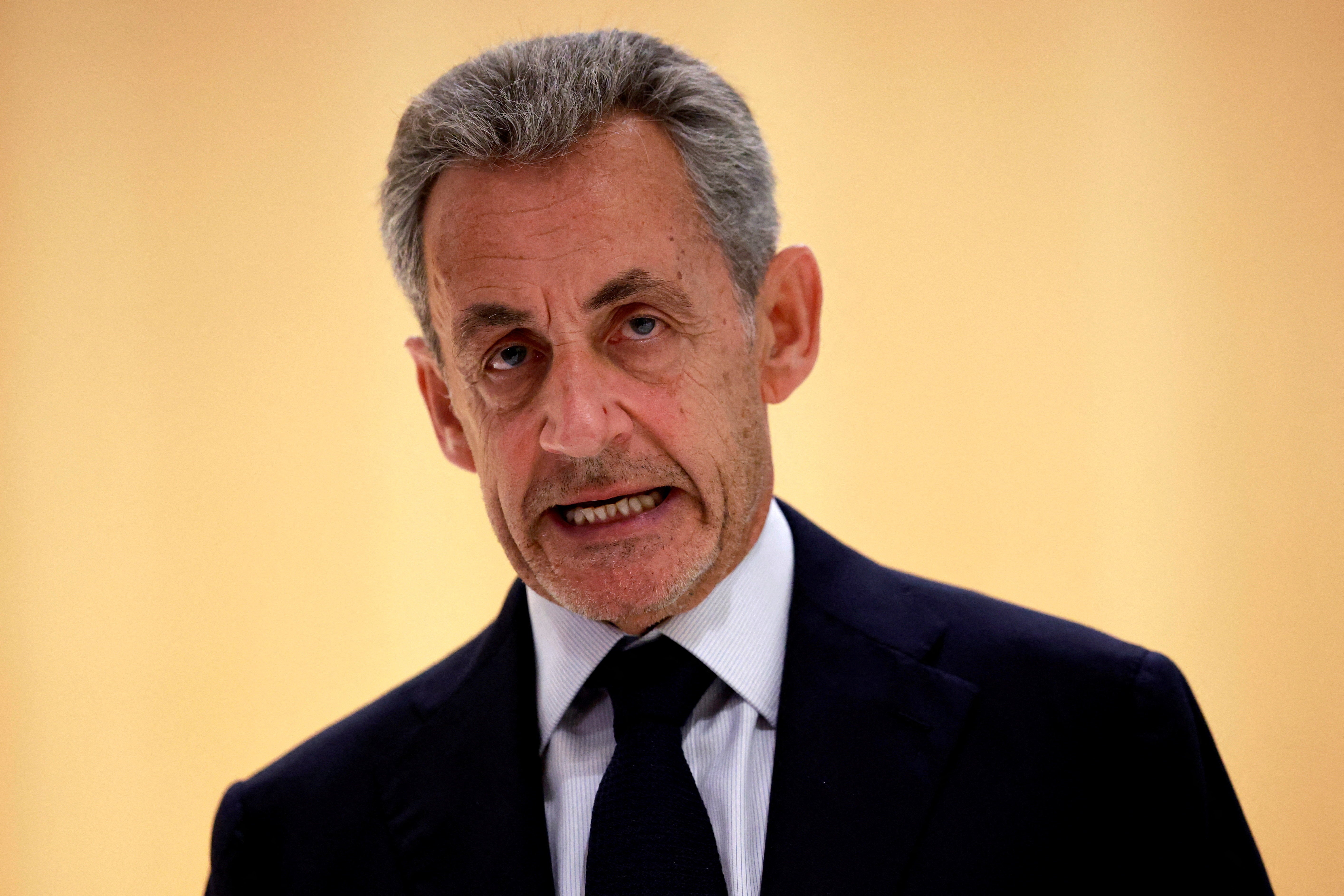 Sarkozy talks to journalists after the verdict