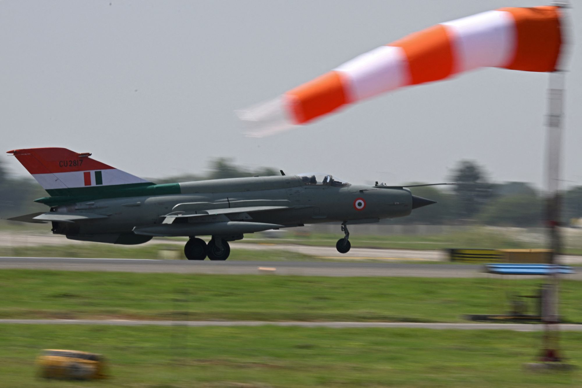 A MIG-21 Bison approaches the tarmac during a rehearsal ahead of its farewell at Chandigarh Air Force Station