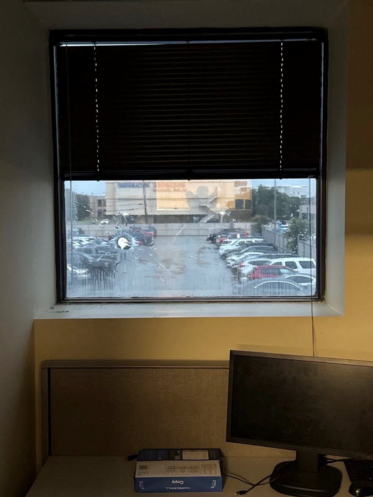 The shooter, 29-year-old Joshua Jahn, sprayed gunfire across the ICE building in Dallas. Bullet holes can be seen in a window