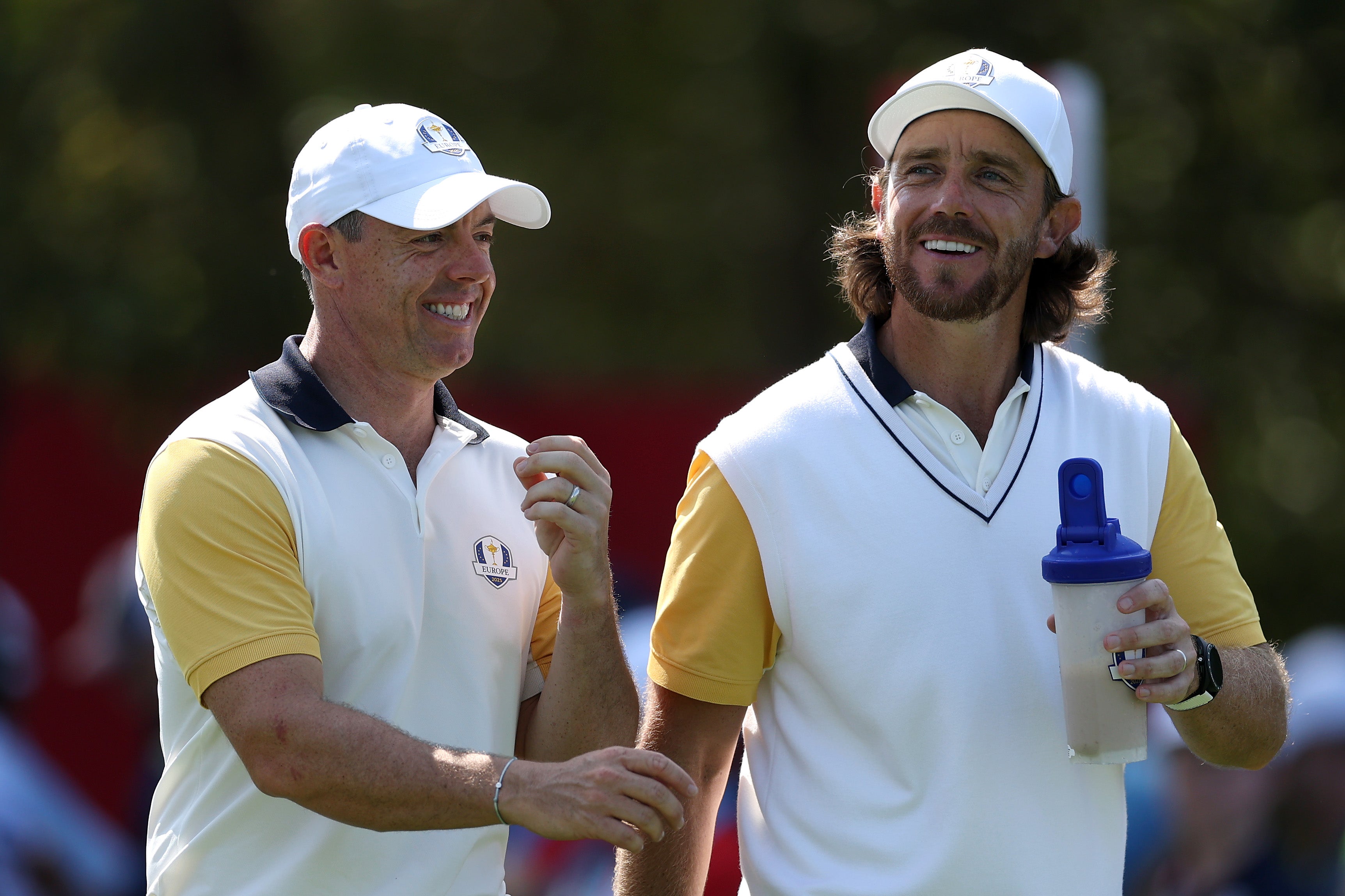 Rory McIlroy talks with Tommy Fleetwood during practice for Team Europe