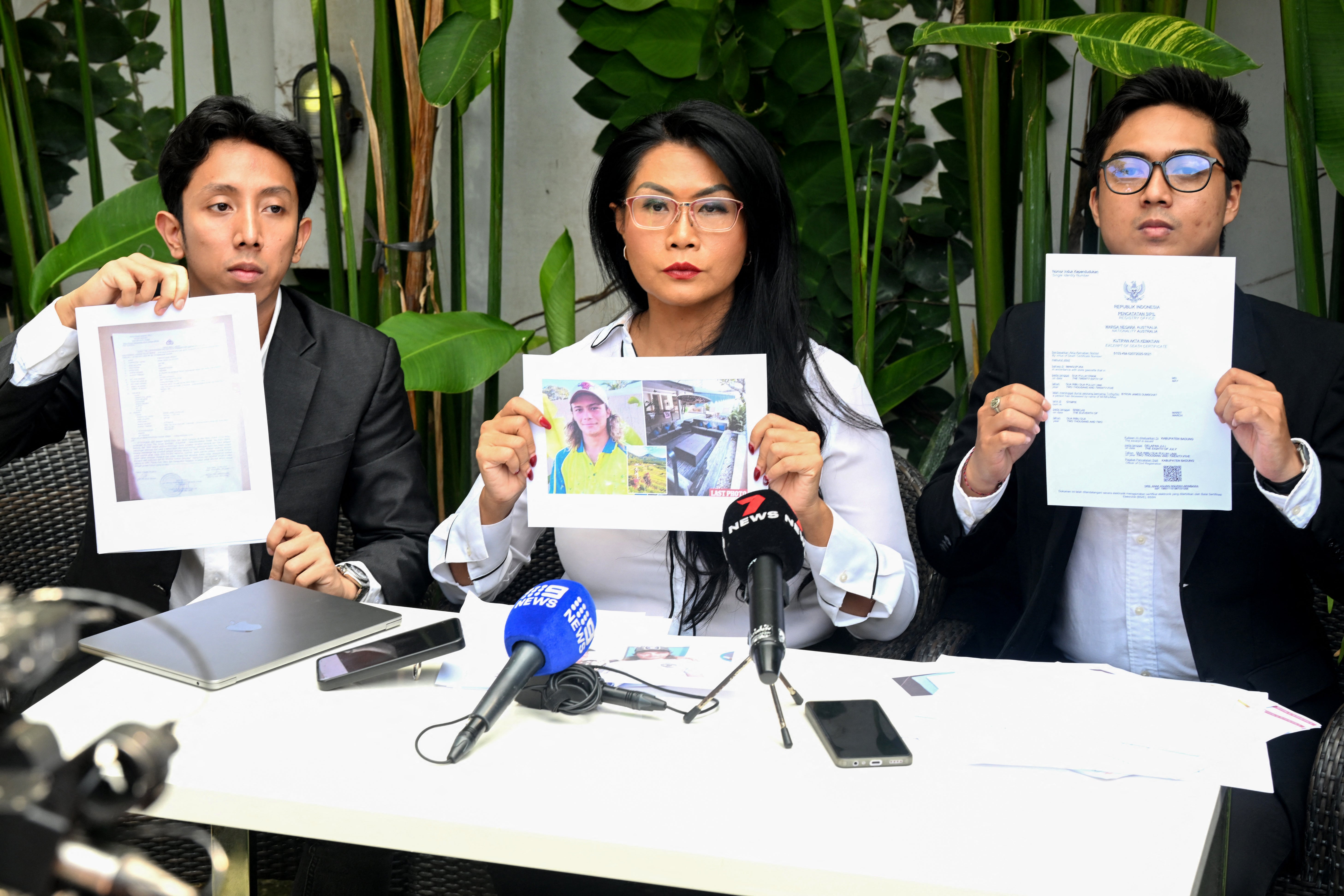The legal team for the family of Byron Haddow hold up documents during a press conference at Tibubeneng Badung regency on Indonesia's resort island of Bali on 24 September 2025