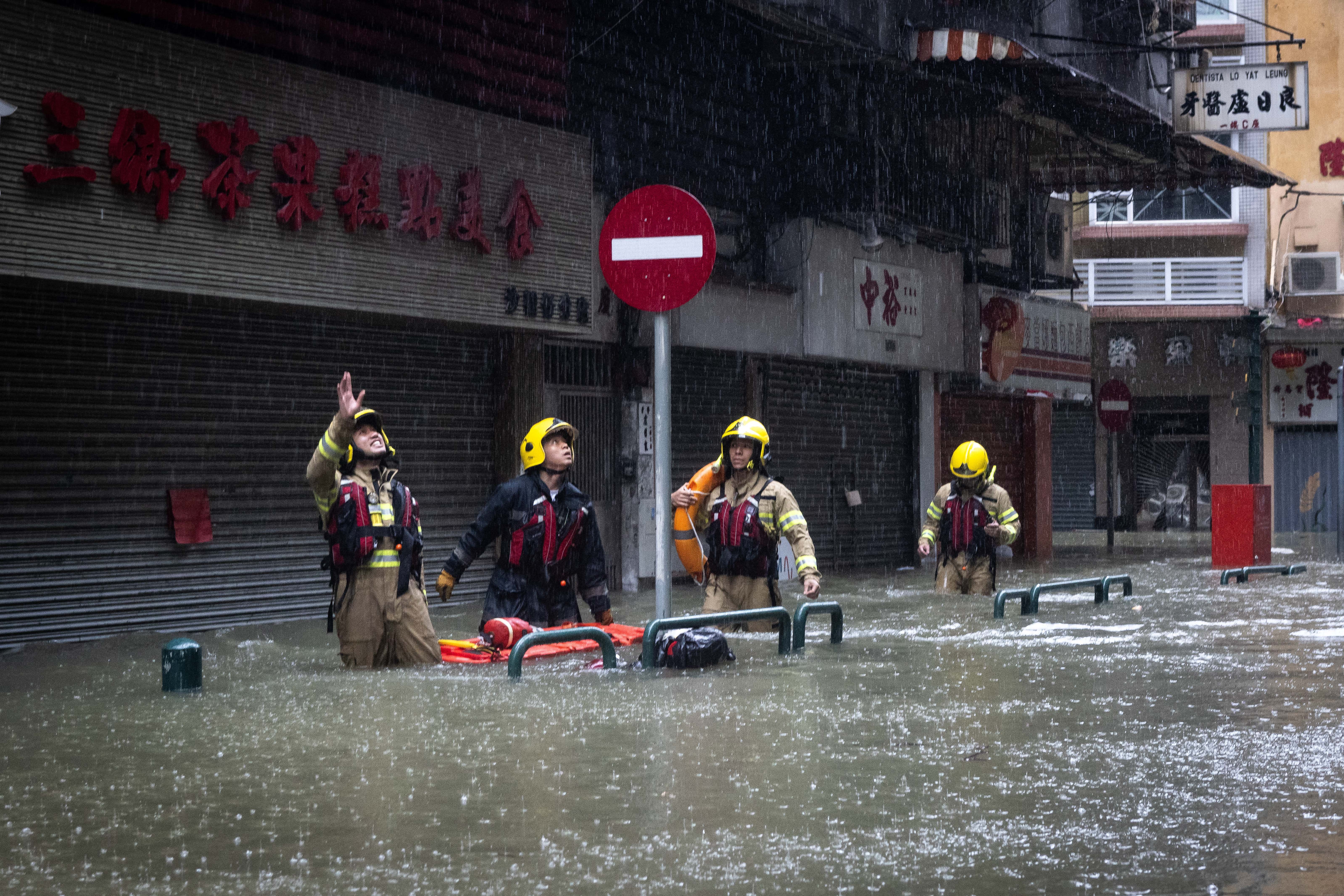 A rescue team works during the passing of Ragasa in Macau on 24 September 2025