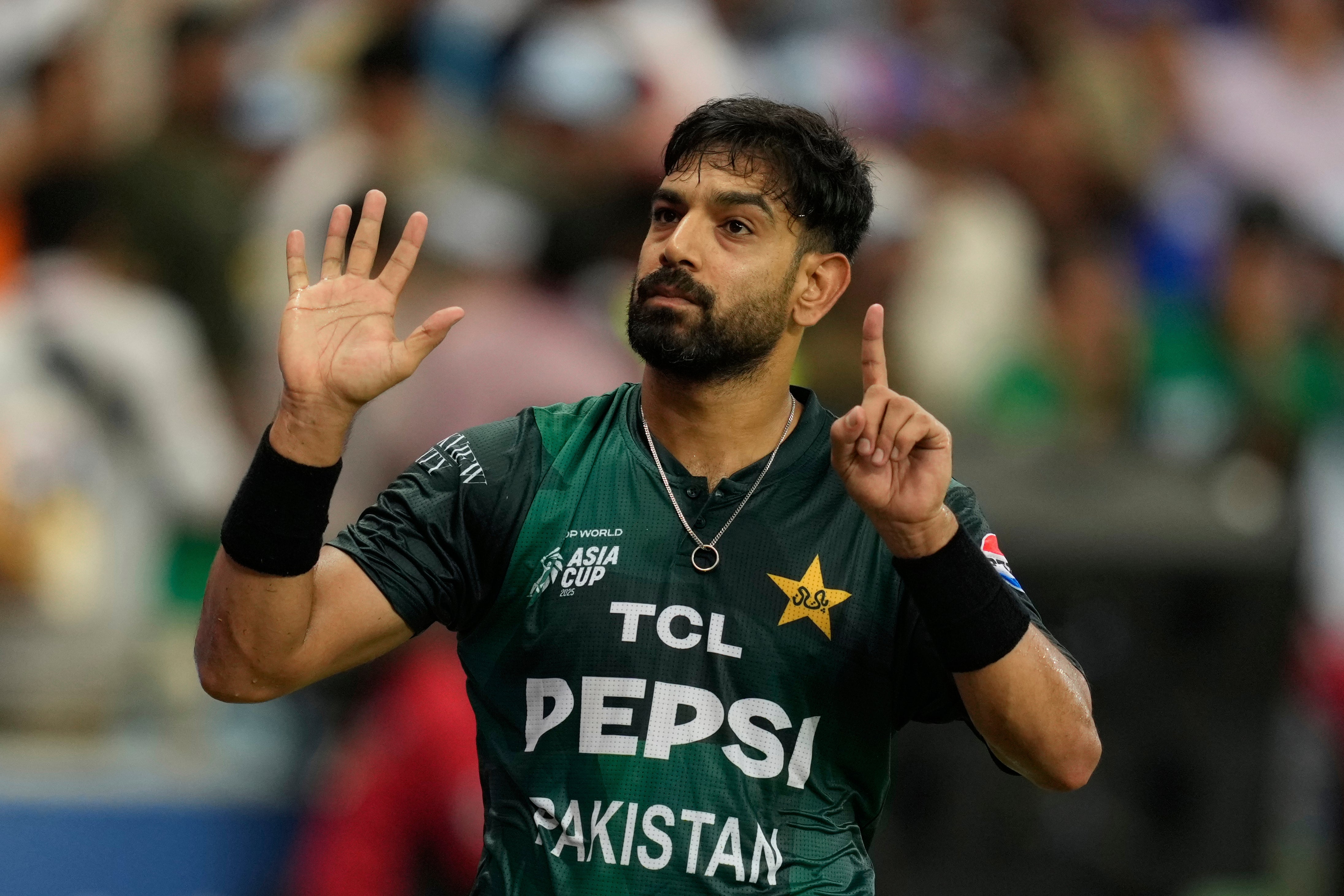 Pakistan’s Haris Rauf gestures towards spectators during the Asia Cup cricket match between India and Pakistan at Dubai International Cricket Stadium, United Arab Emirates, Sunday, 21 September 2025