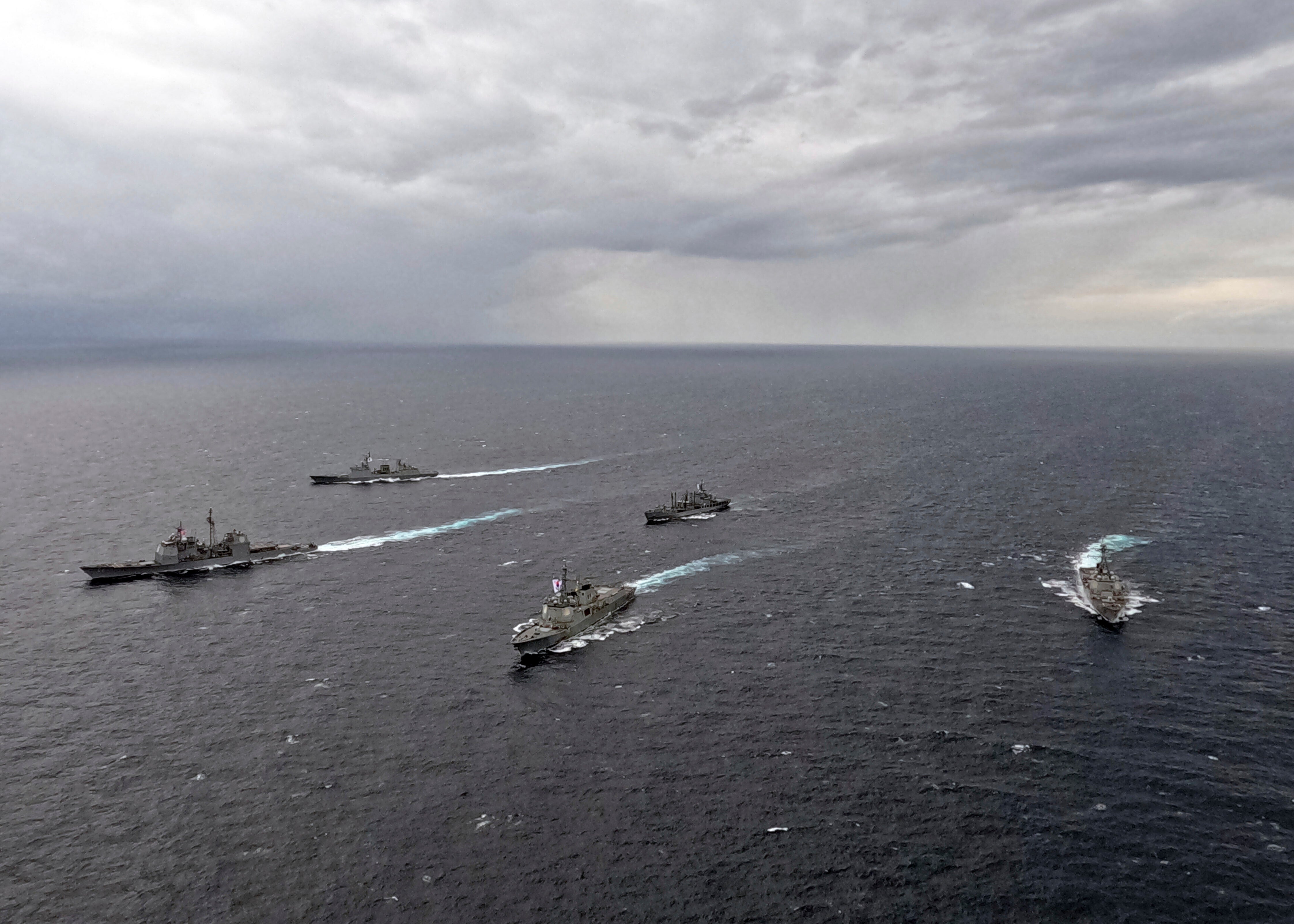 Naval ships sail during a joint naval exercise in South Korea's East Sea