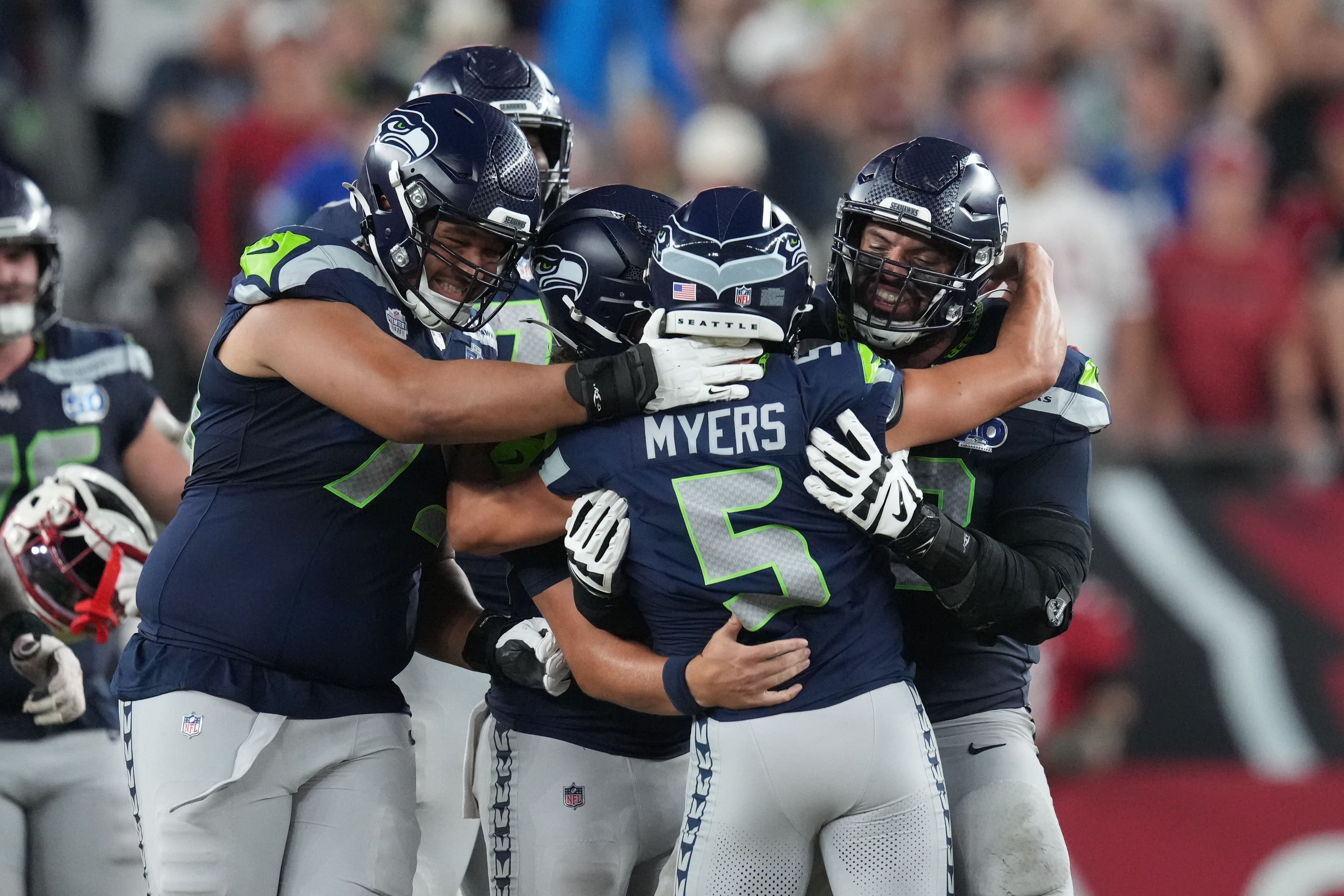 Seattle Seahawks kicker Jason Myers (5) is congratulated by teammates (Ross D. Franklin/AP)