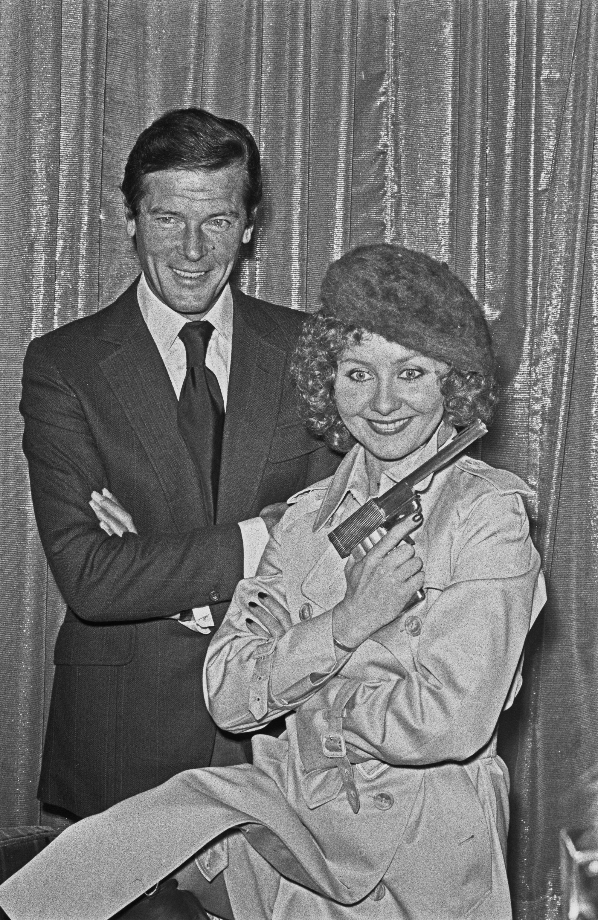 Lulu promoting ‘The Man with the Golden Gun’ with Roger Moore in 1974