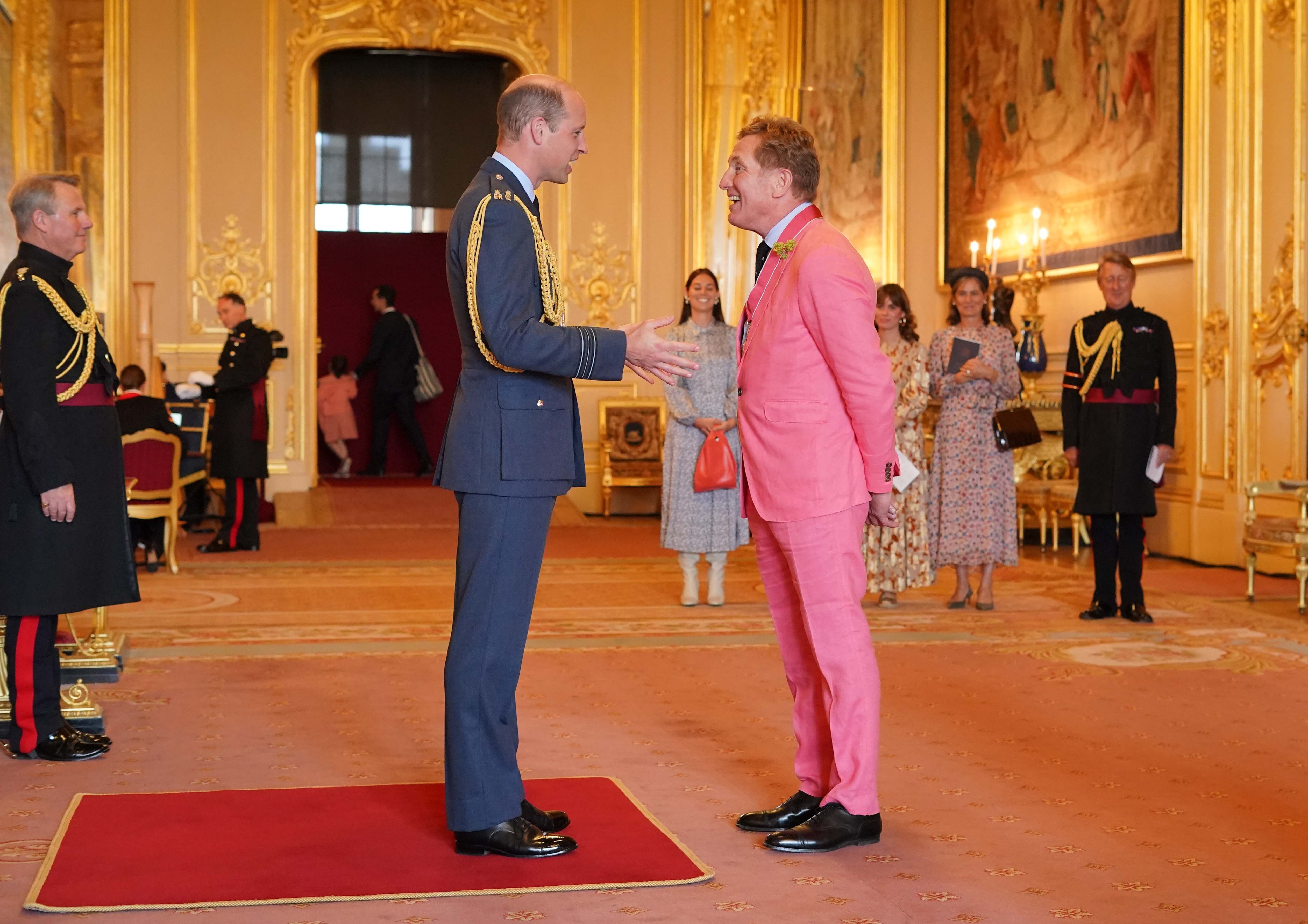 Johnnie Boden, founder of Boden, receives his CBE from the Prince of Wales at Windsor Castle in 2023