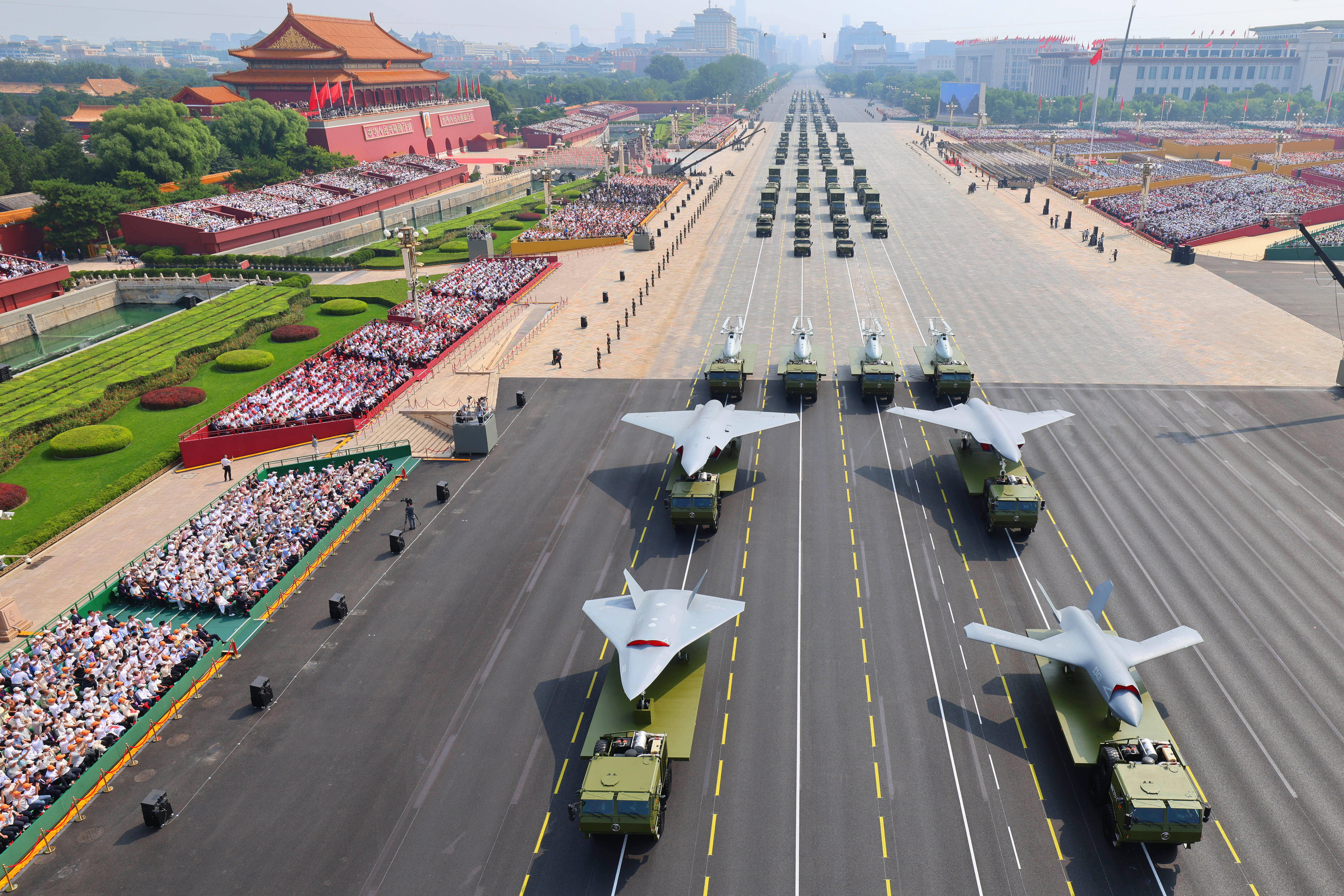 Drones and other armament formations pass during the military parade to commemorate the 80th anniversary of the end of World War II held in front of Tiananmen Gate in Beijing, Wednesday