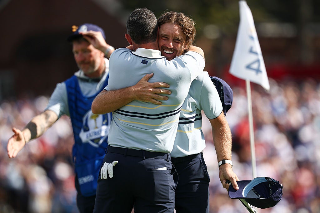 Rory McIlroy embraces Tommy Fleetwood after their foursomes victory