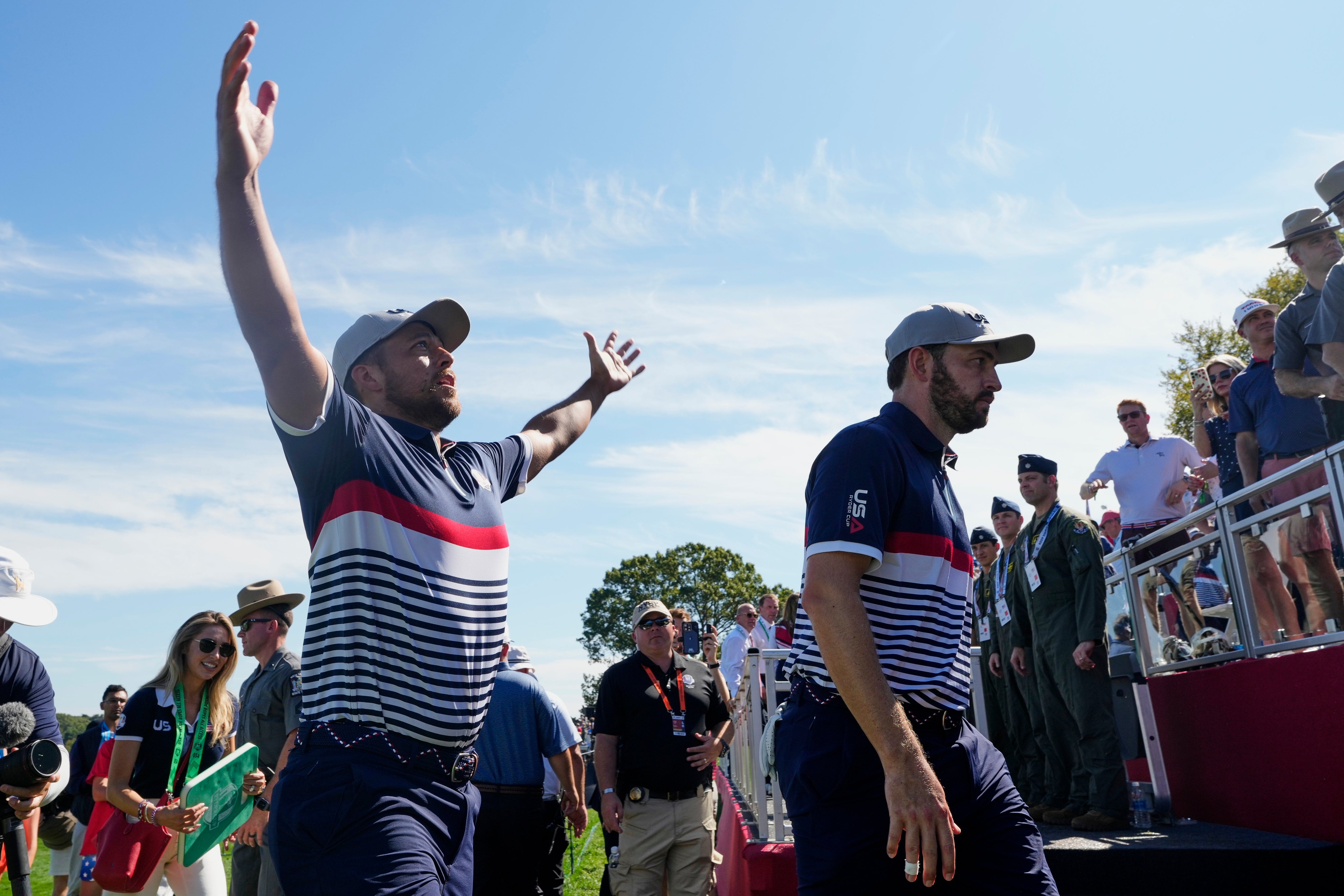Xander Schauffele and Patrick Cantlay walk off the course