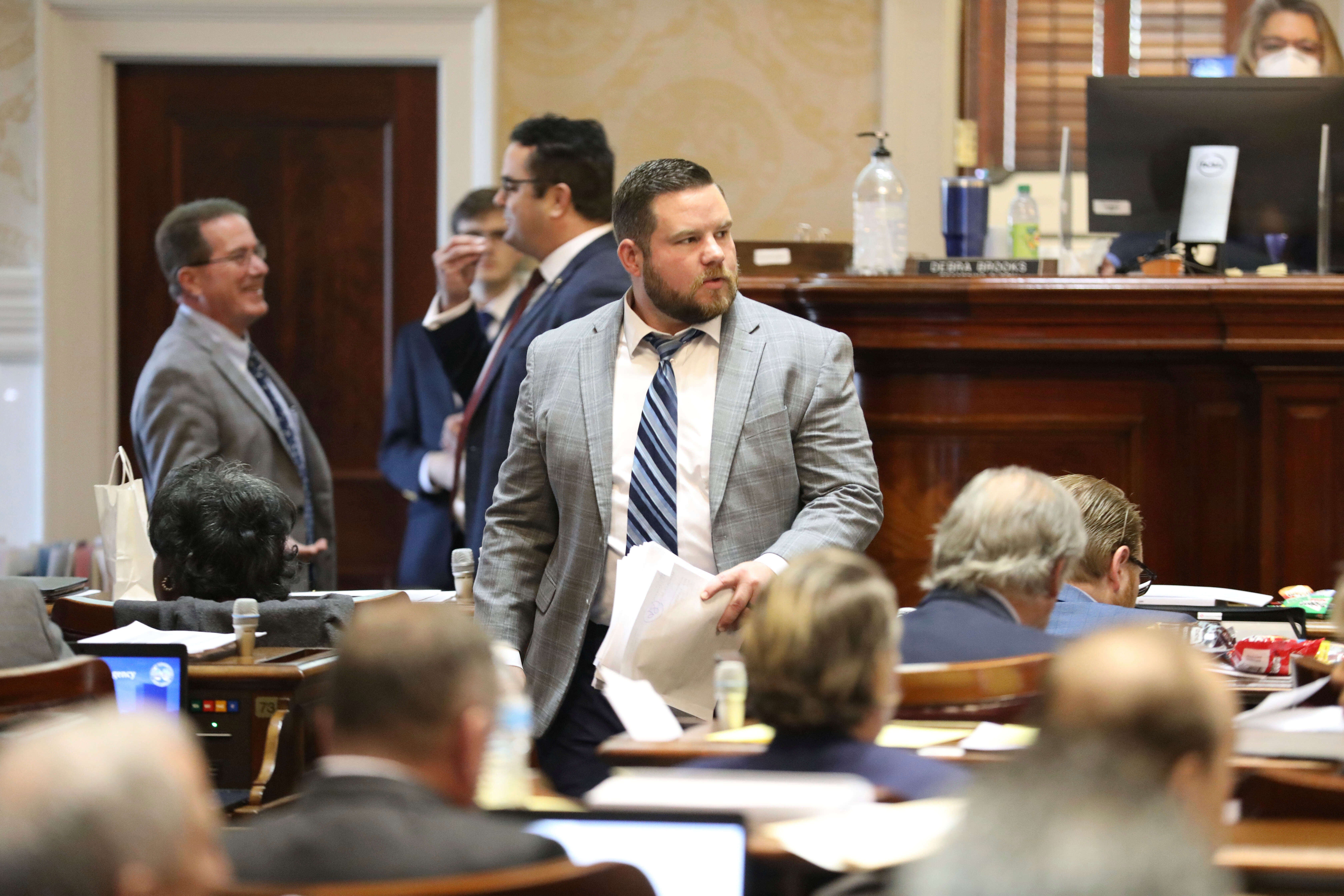 South Carolina Rep. RJ May, R-West Columbia, walks down the aisle of the House on Tuesday, March 14, 2023, in Columbia, South Carolina. (AP Photo/Jeffrey Collins, file)