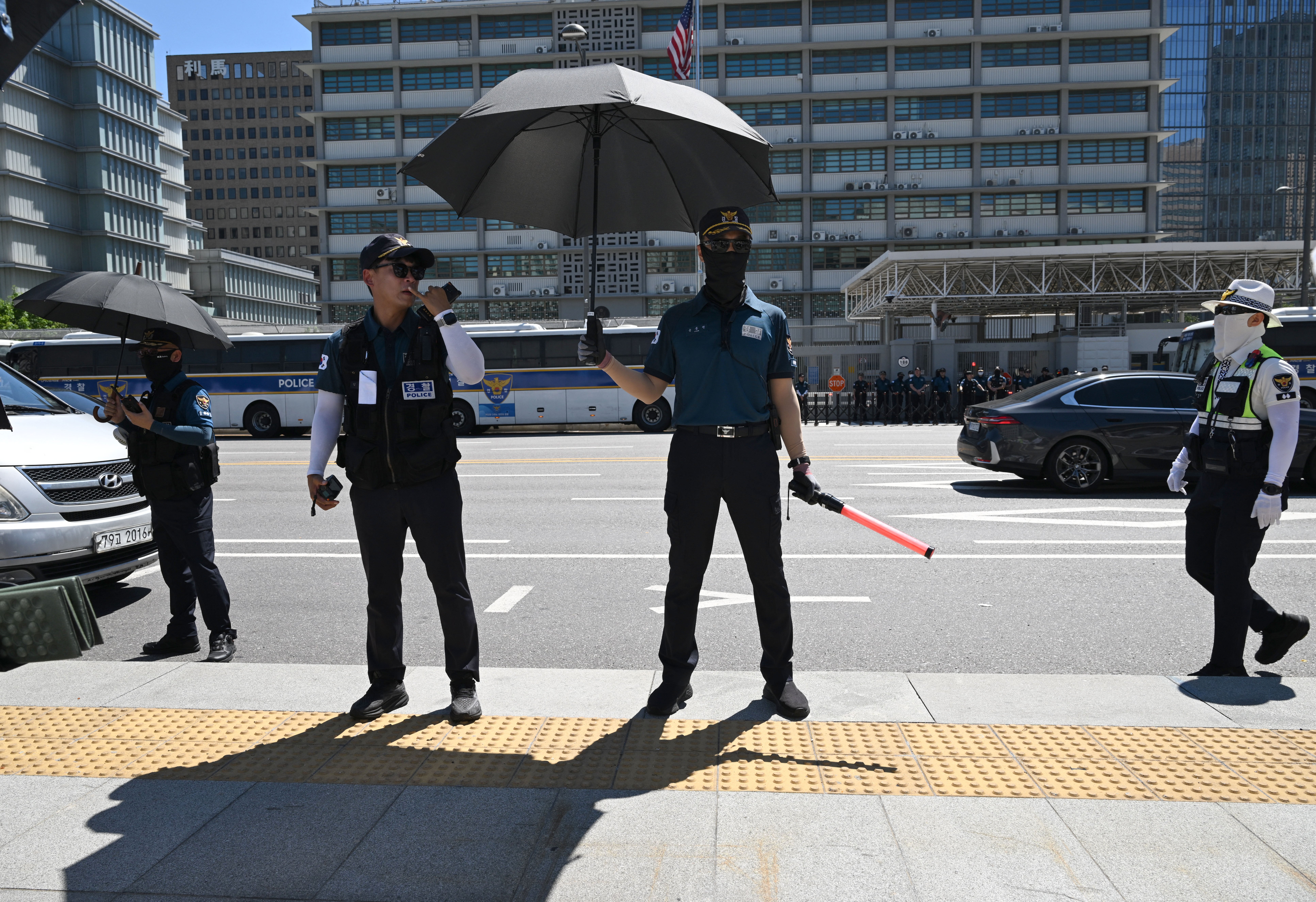 Police officers stand guard against in South Korea