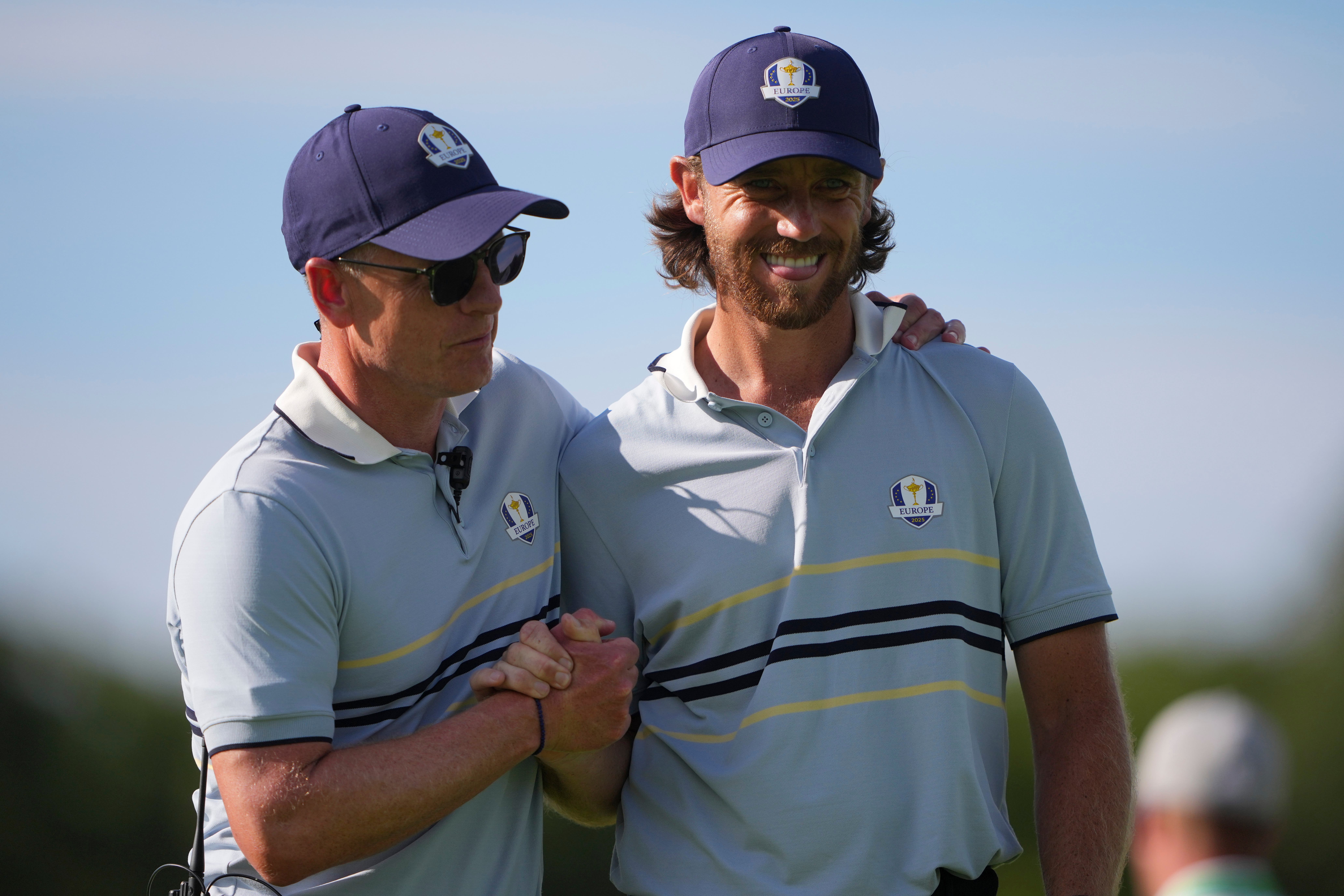 Europe captain Luke Donald hugs Tommy Fleetwood on the 11th hole at Bethpage Black golf course (Lindsey Wasson/AP)