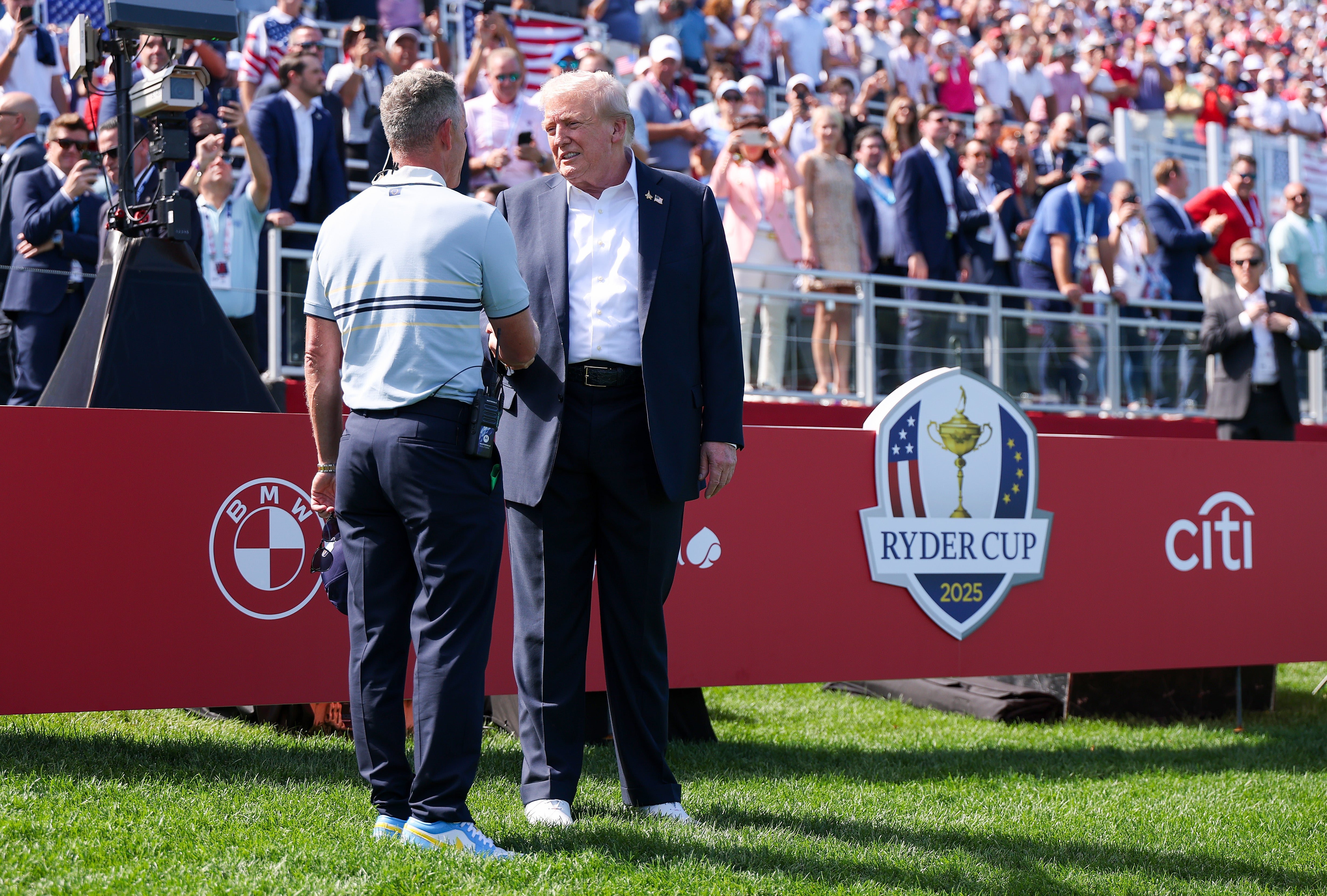 Luke Donald shakes hands with President Trump at Bethpage Black