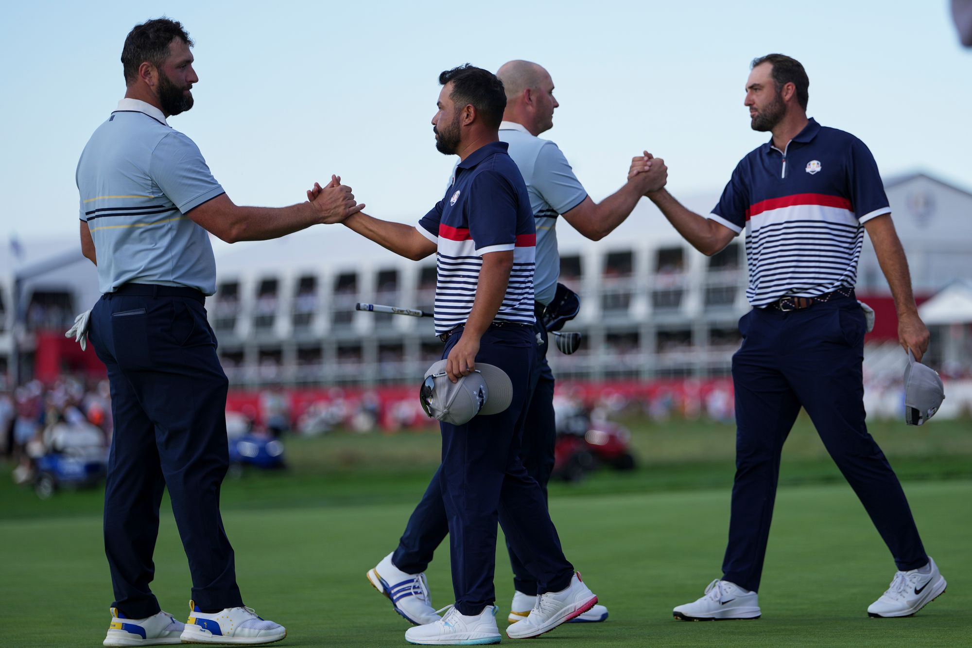Europe's Jon Rahm and Sepp Straka celebrates after their win against United States' Scottie Scheffler and J.J. Spaun on the 16th hole