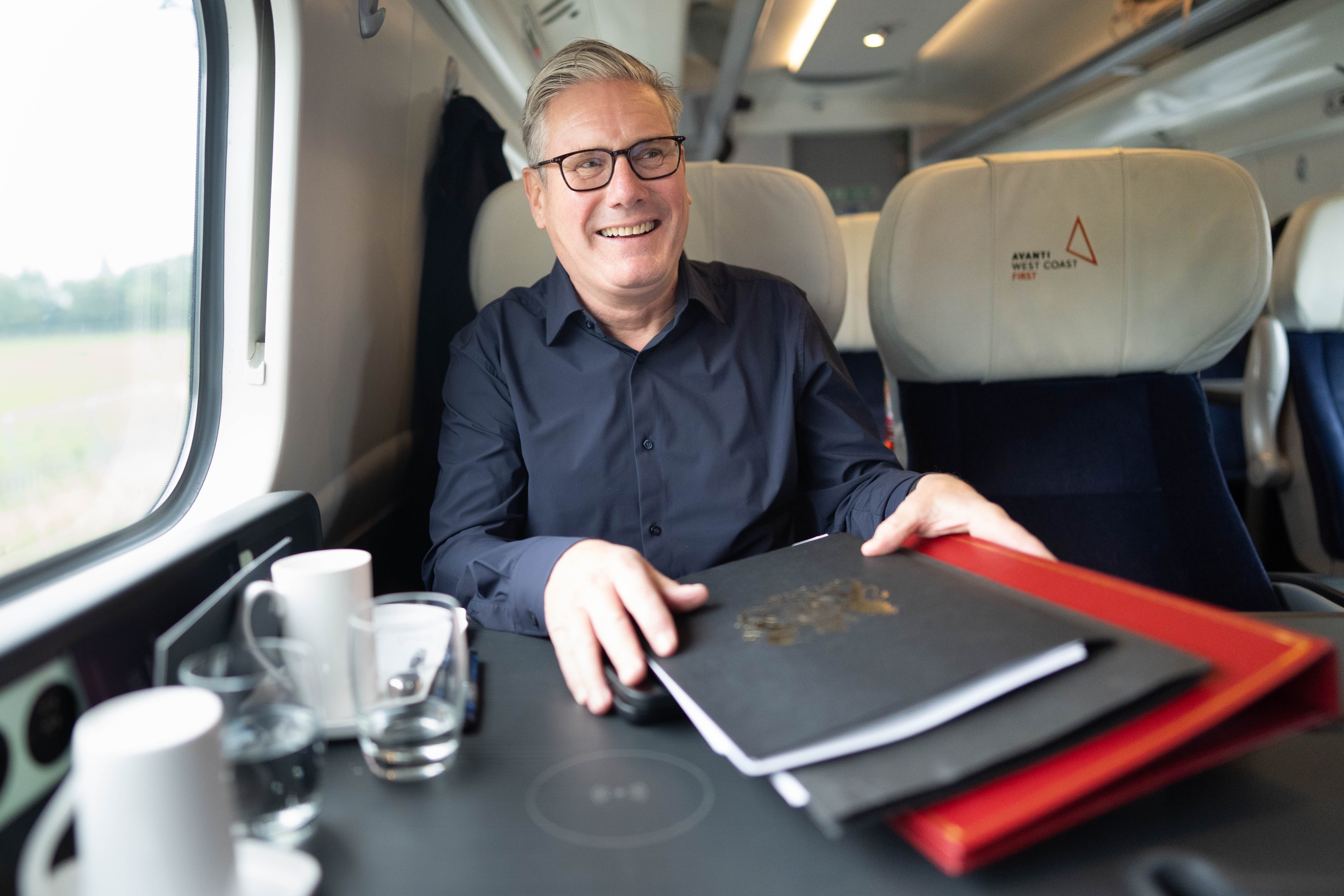 Prime Minister Sir Keir Starmer on the train to Liverpool (Stefan Rousseau/PA)