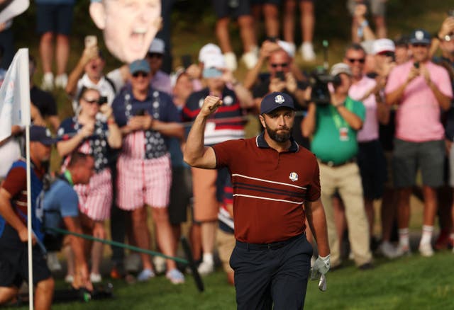 <p>Team Europe's Jon Rahm celebrates after chipping in on the 8th hole</p>