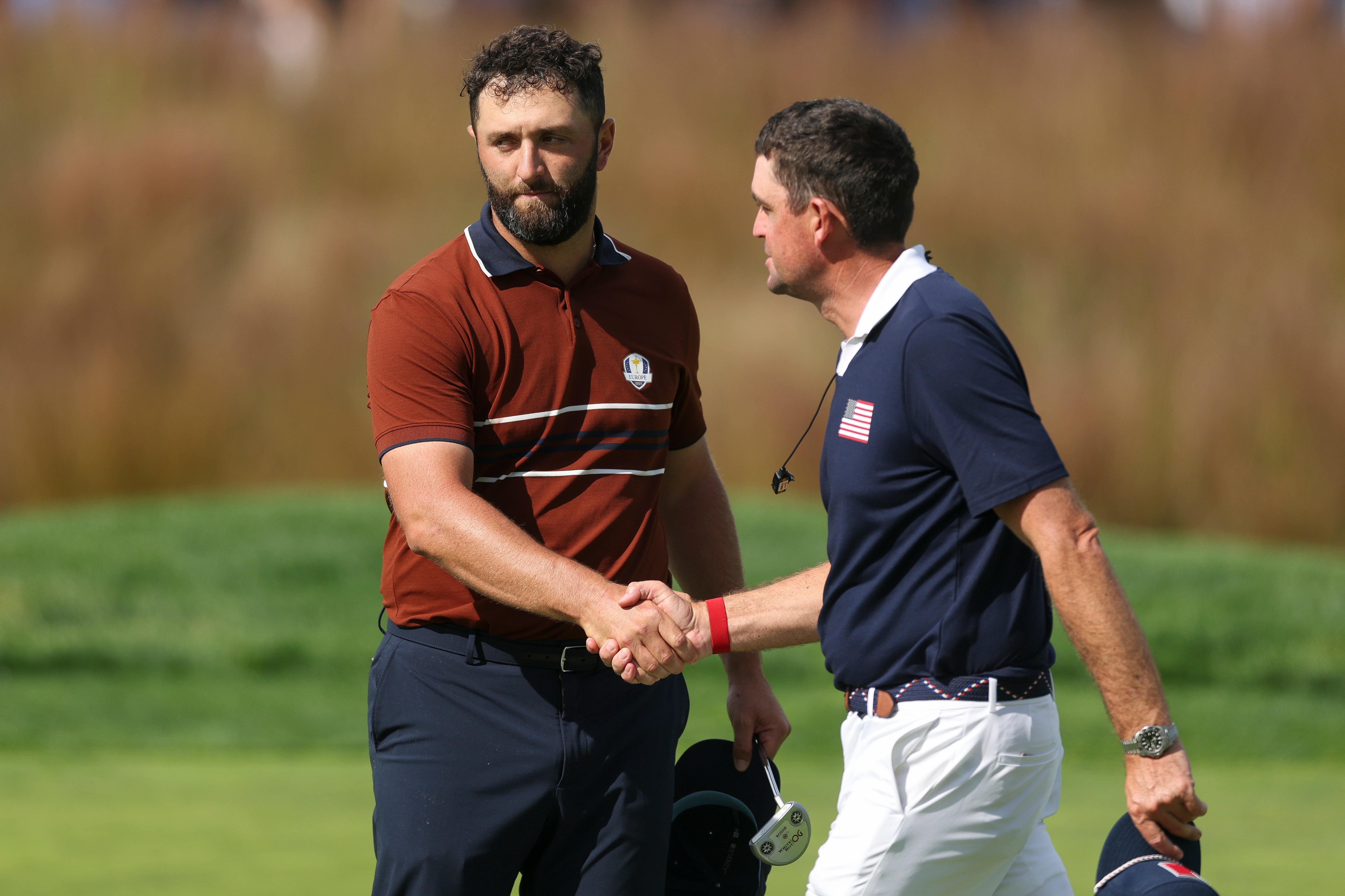 Rahm shakes hands with Team USA captain Keegan Bradley