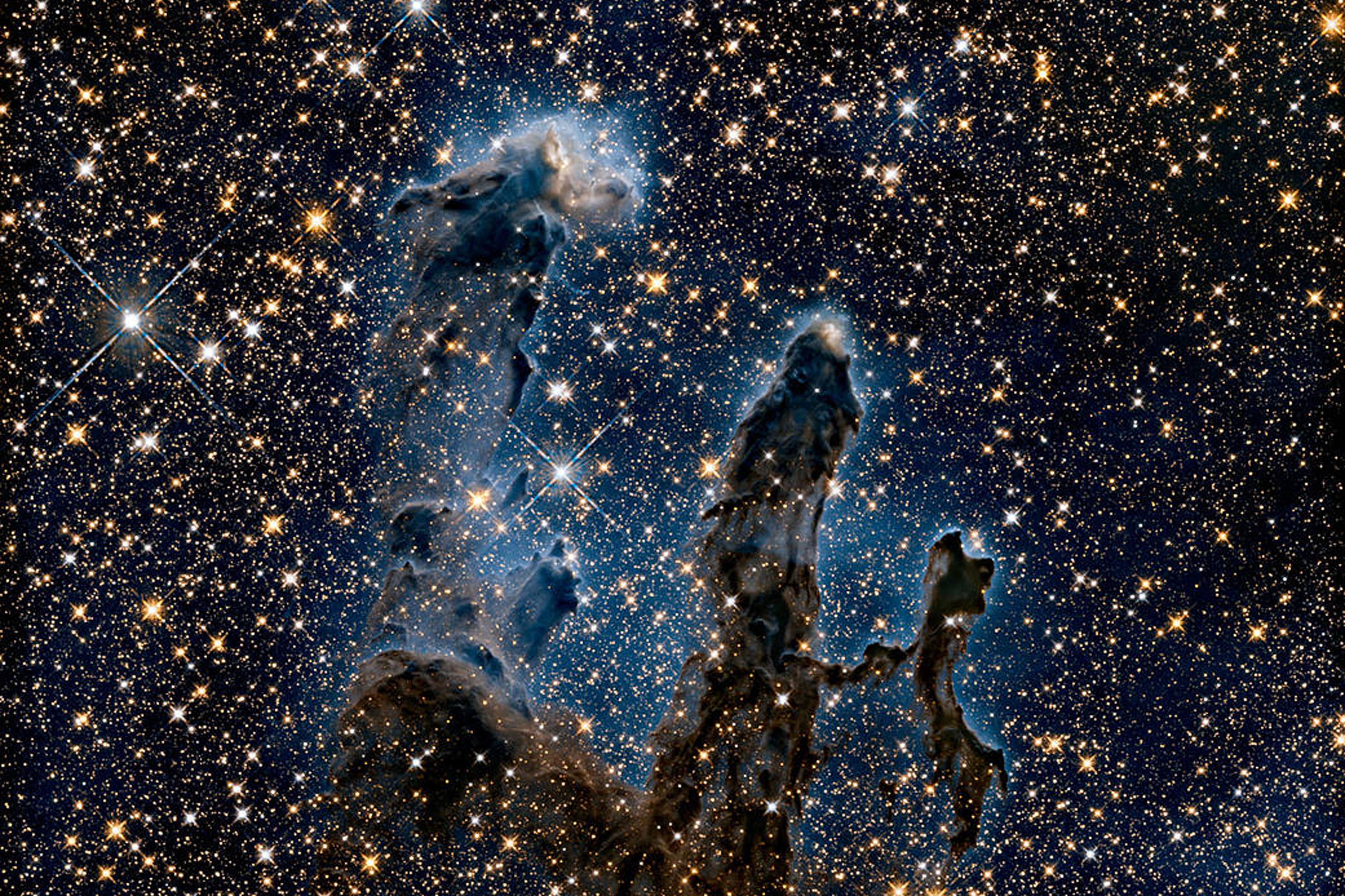 <p>Cosmic dust is found in the ‘Pillars of Creation’ (NASA)</p>