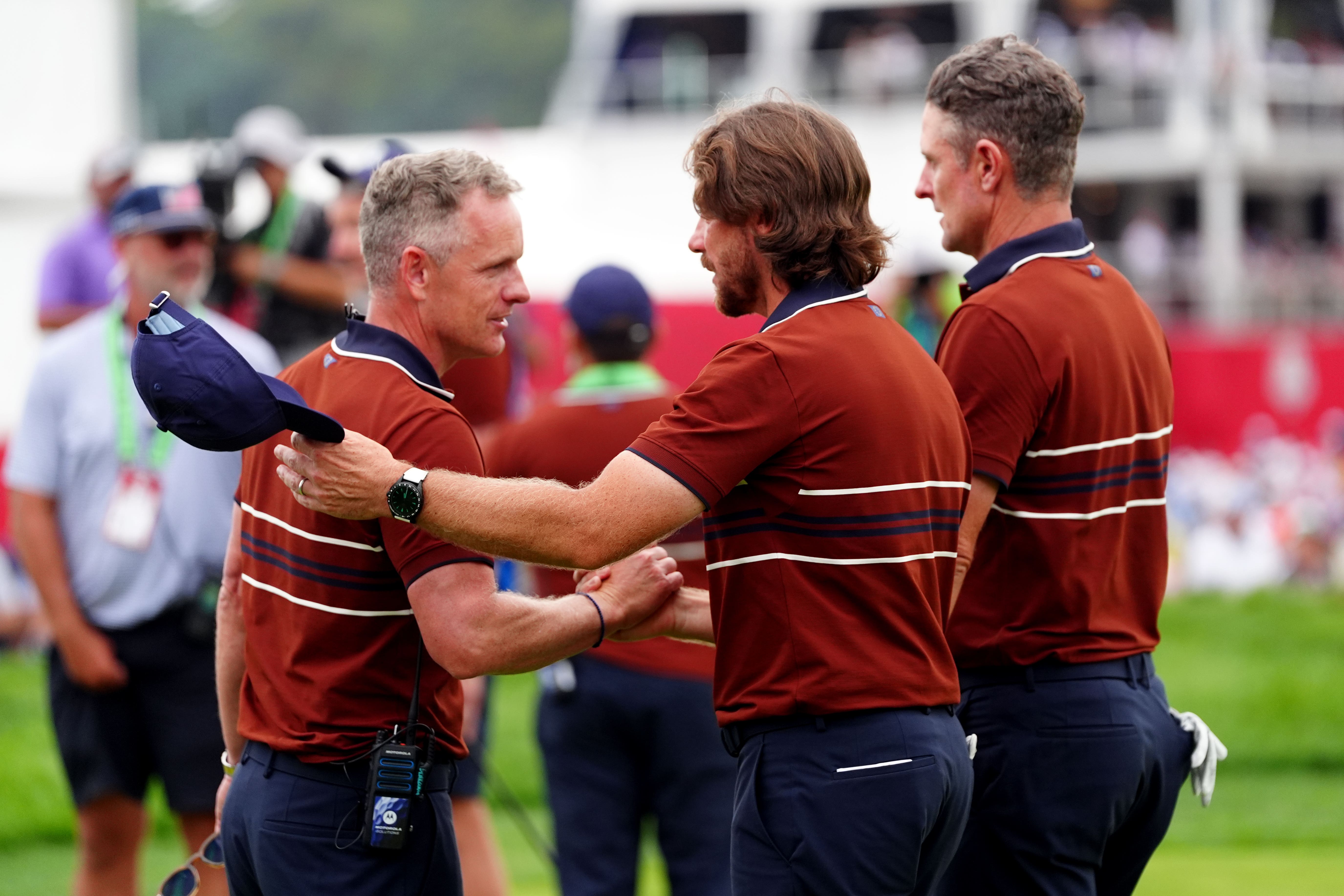 Captain Luke Donald, left, with Tommy Fleetwood and Justin Rose (David Davies/PA)