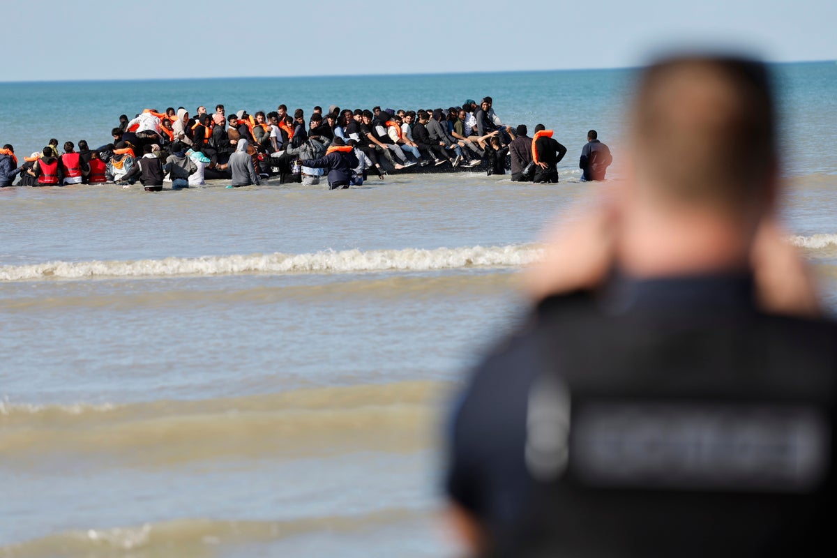 Single boat carrying record 125 migrants crosses Channel to UK