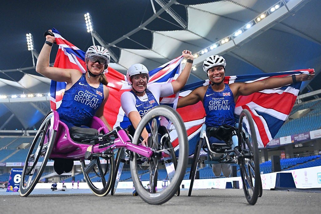 Hannah Cockroft (centre) celebrates her victory with compatriots Kare Adenegan (right) and Fabienne Andre (left)