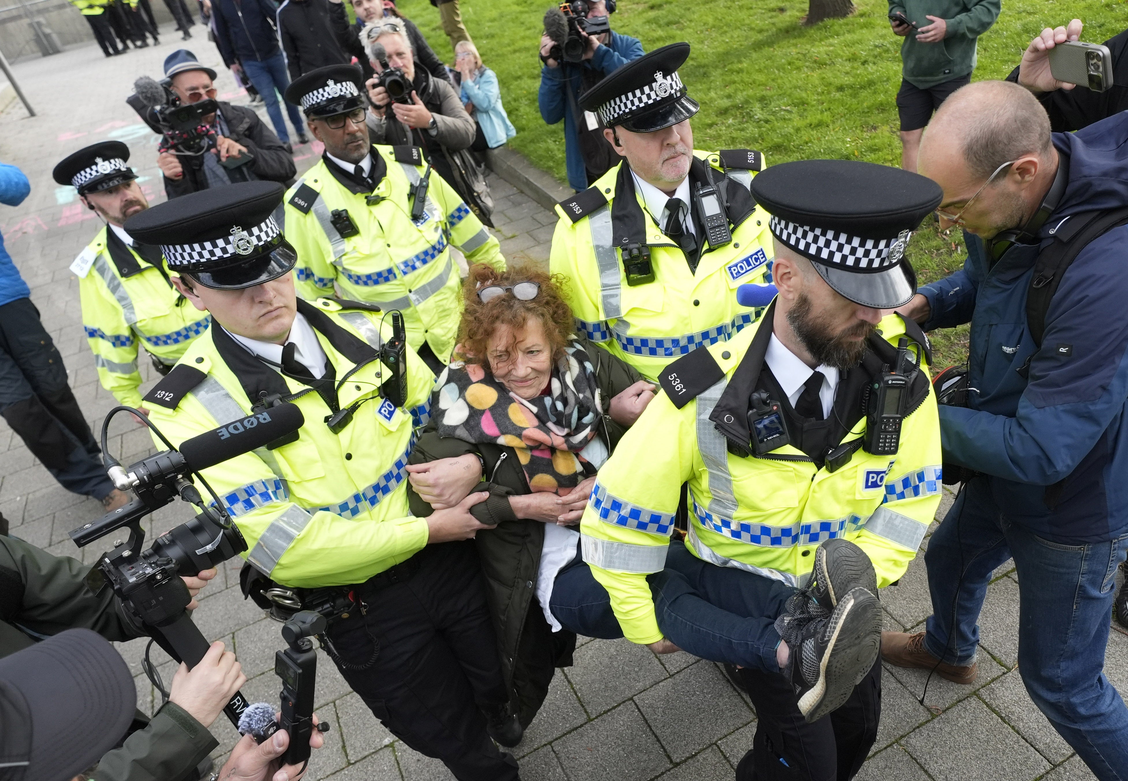 A protester is carried away by police at a Palestine Action demonstration in Liverpool