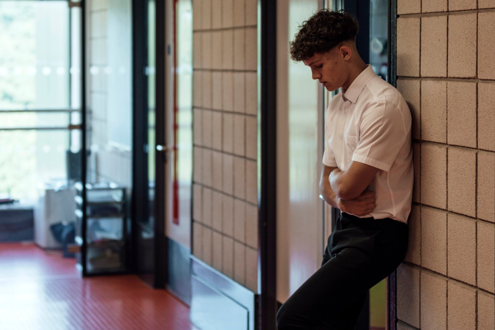 Strict uniform and appearance codes require shirts to be tucked in and ties to be straight