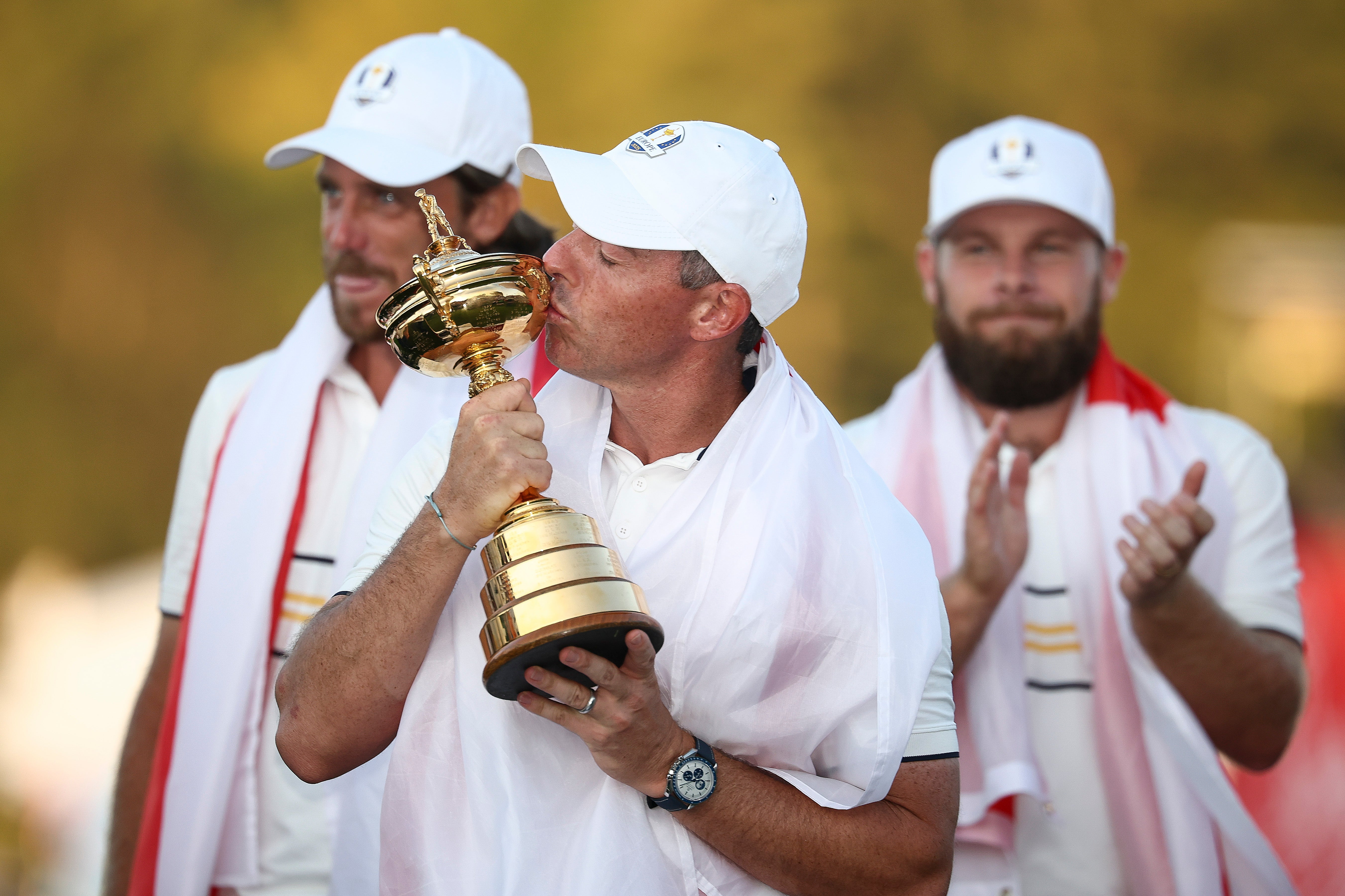Rory McIlroy of Team Europe kisses the Ryder Cup trophy