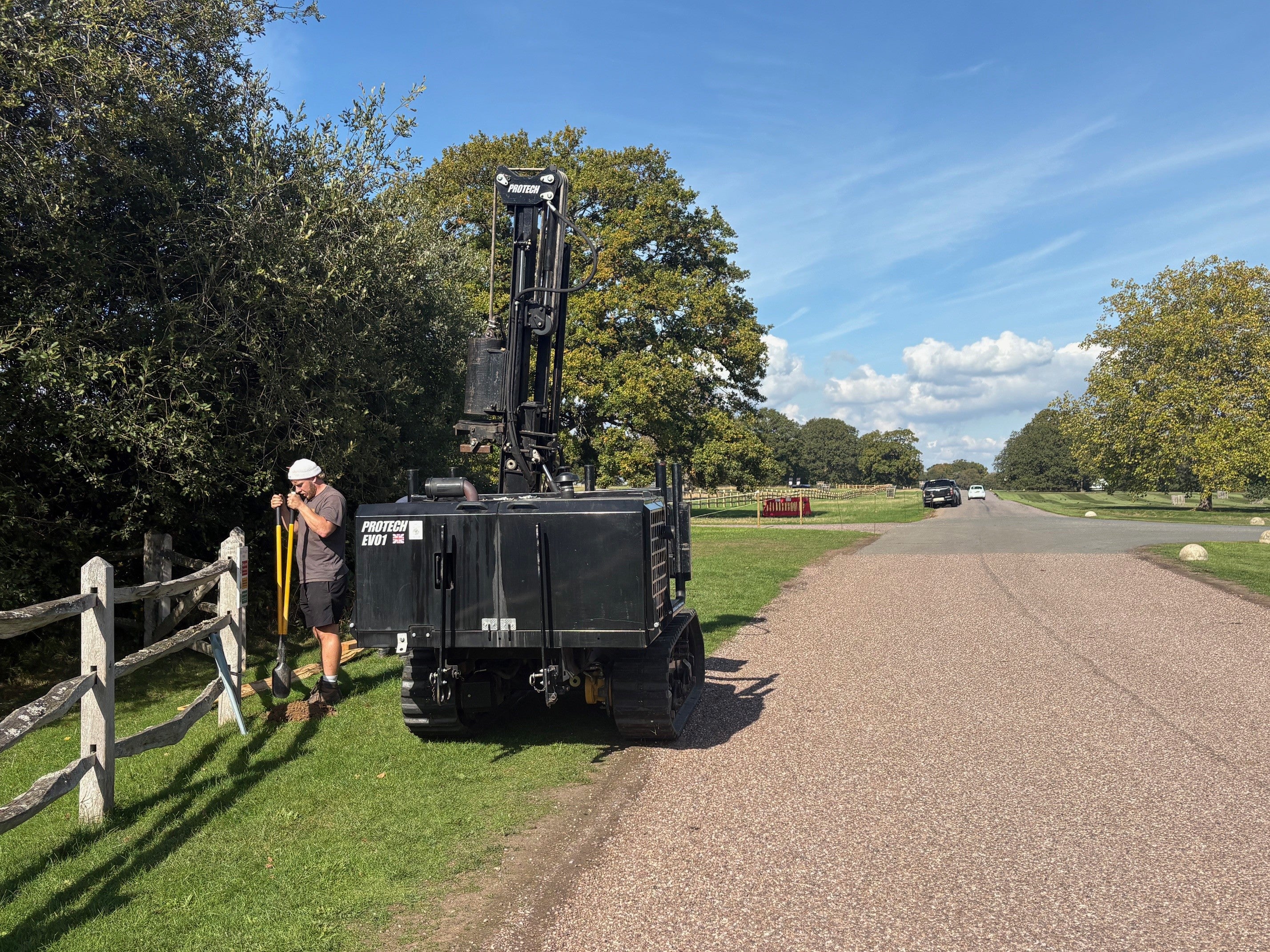 A view of workmen installing fencing on the perimeter of the new exclusion zone in Windsor Great Park
