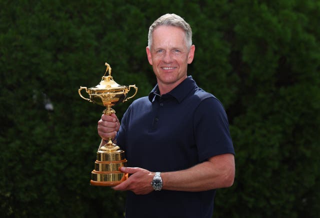 <p>Luke Donald, European Ryder Cup captain, poses with the trophy at the Garden City Hotel</p>