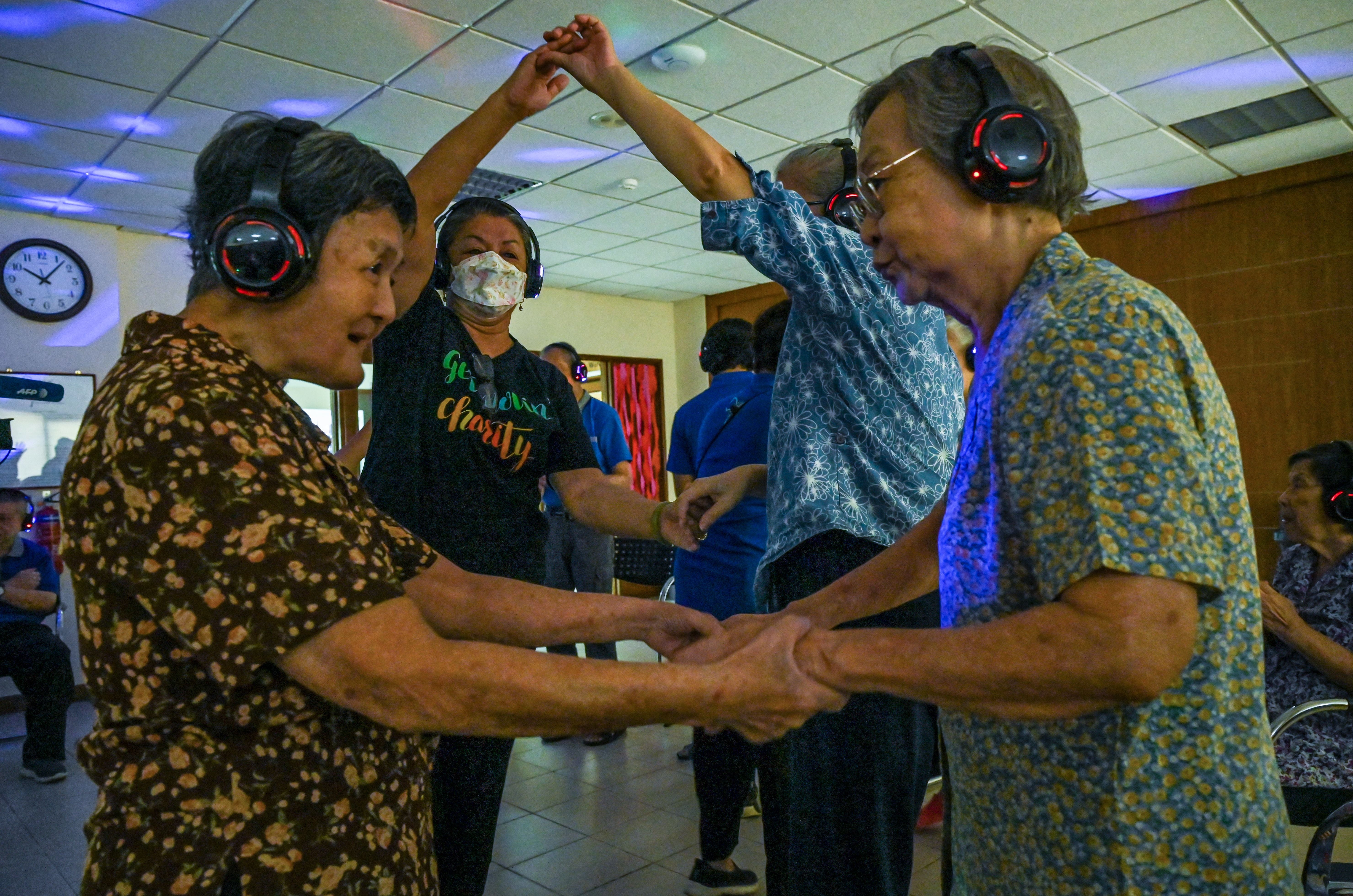 People with dementia participate in a silent disco in Singapore