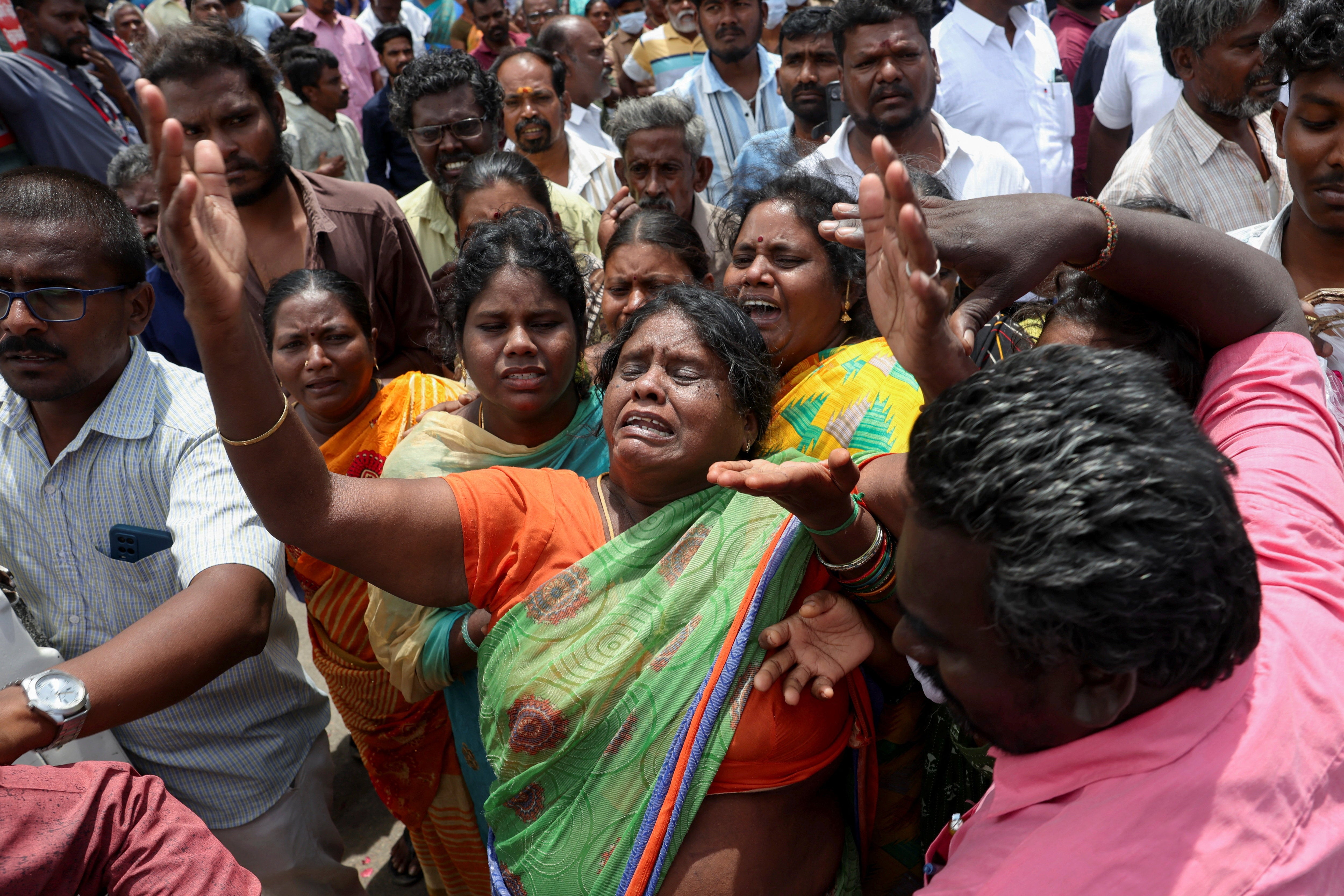 Relatives of the victims mourn at the Karur Government Medical College Hospital following the stampede in Tamil Nadu