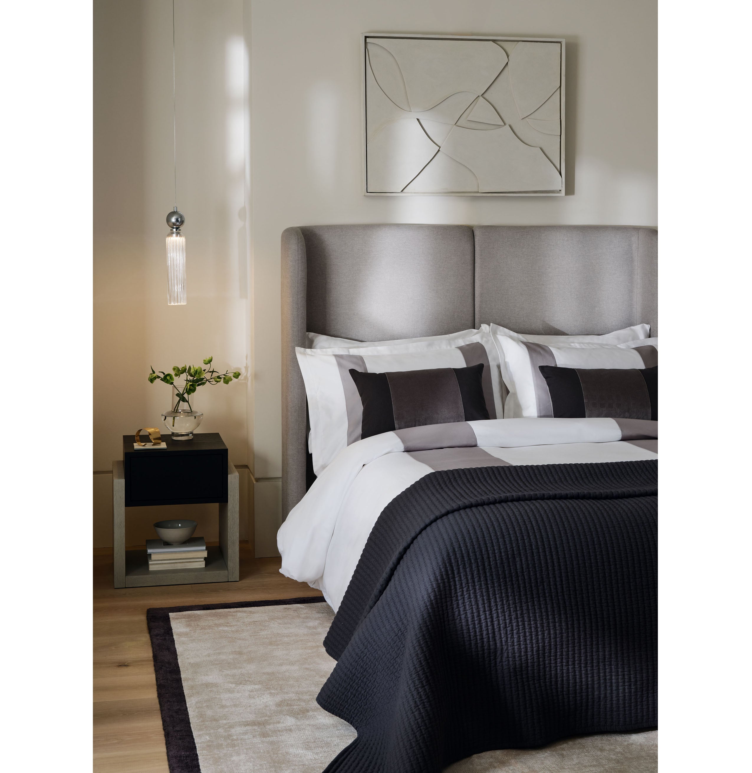 A perfectly made bed is key to making your room at home feel like you’re in a hotel