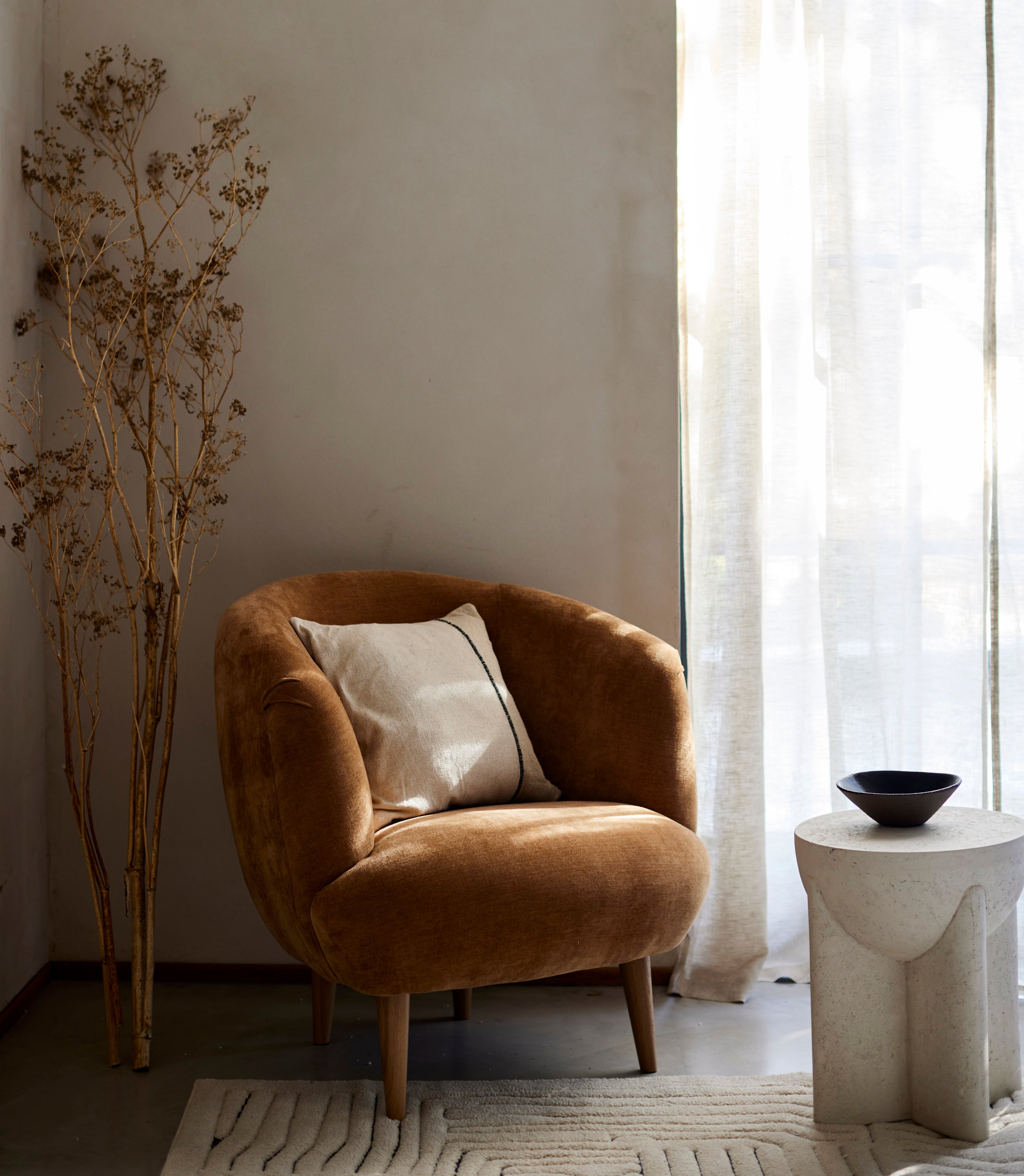 Having a chair in a room adds a lounge element to your space - something that is often found in hotel rooms