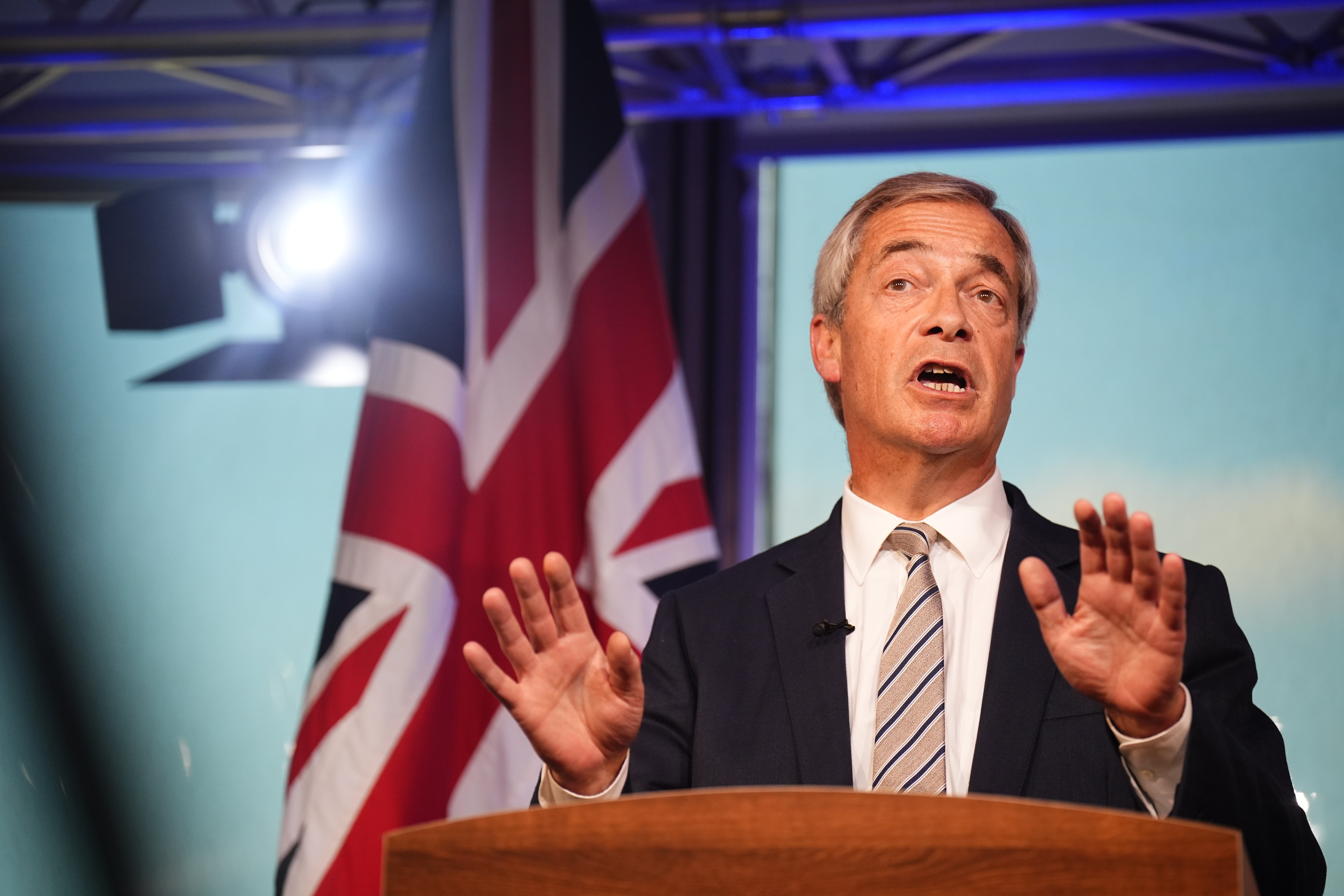 Reform UK leader Nigel Farage reacts to Keir Starmer’s speech