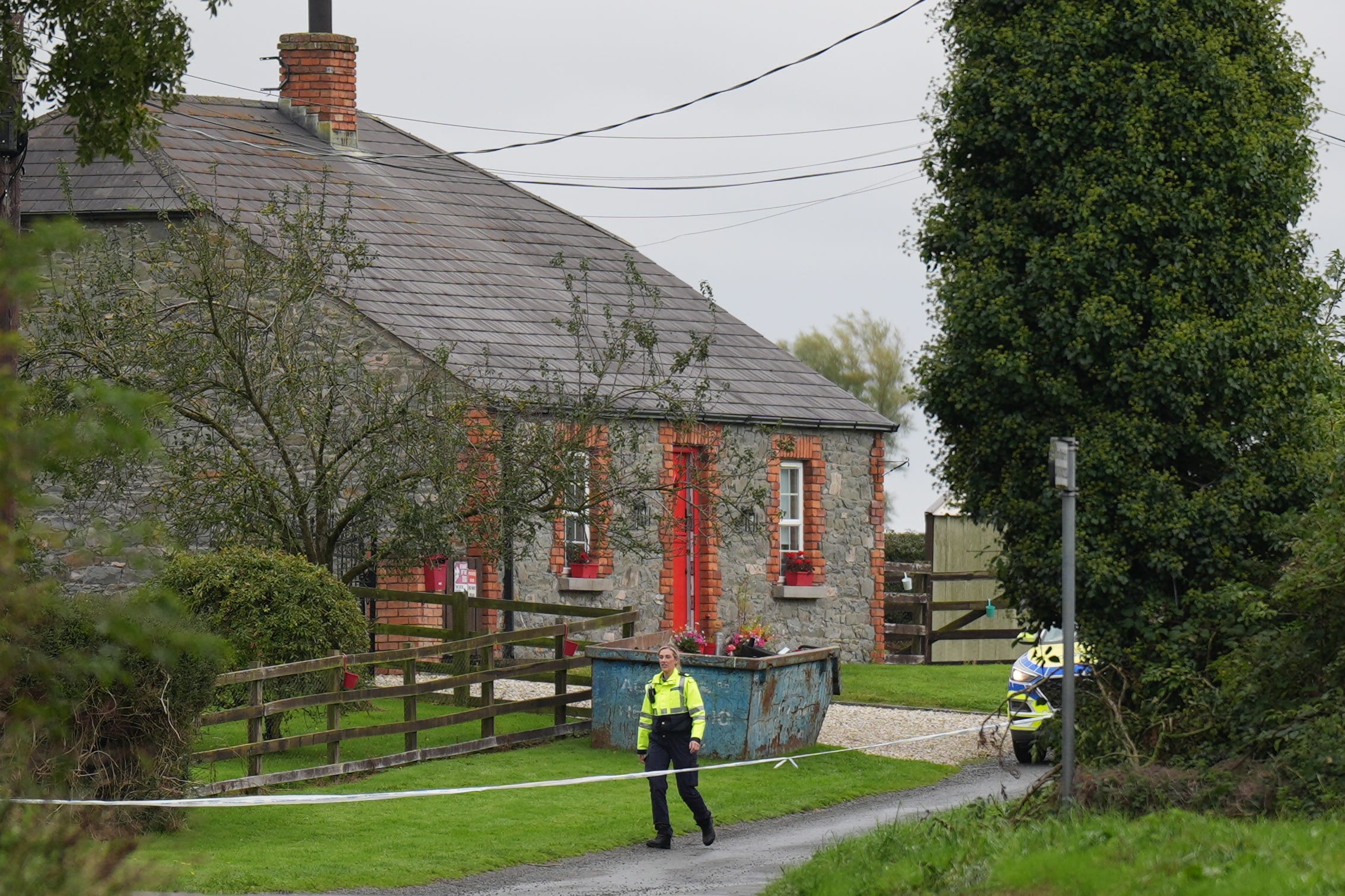 Garda at the scene in Dromgowna, outside Tallanstown village (PA)