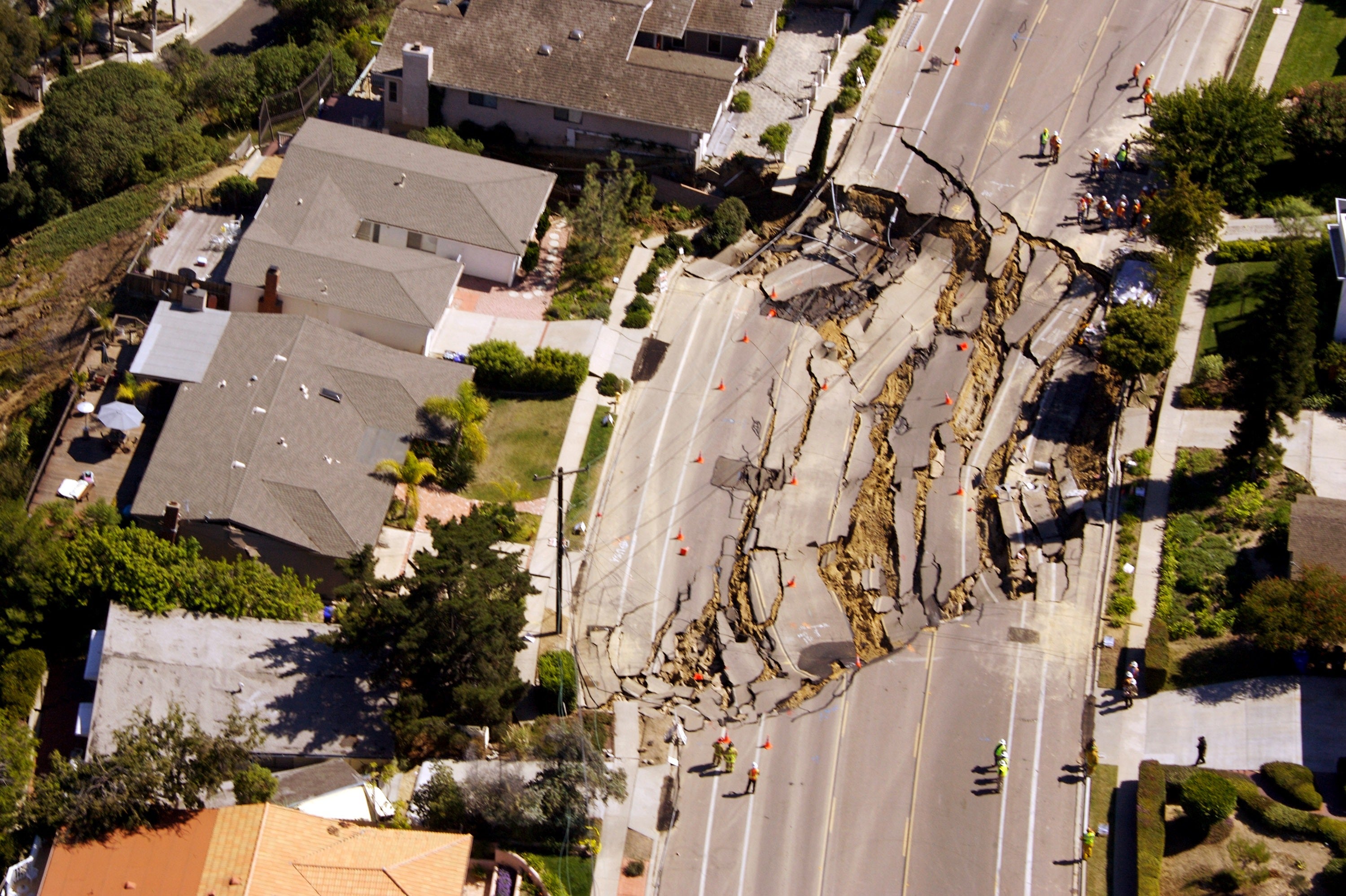 A sinkhole spanning more than 200 feet is seen in a road in La Jolla, California in 2007. Southern California saw a sinkhole swallow cars last May in Ventura