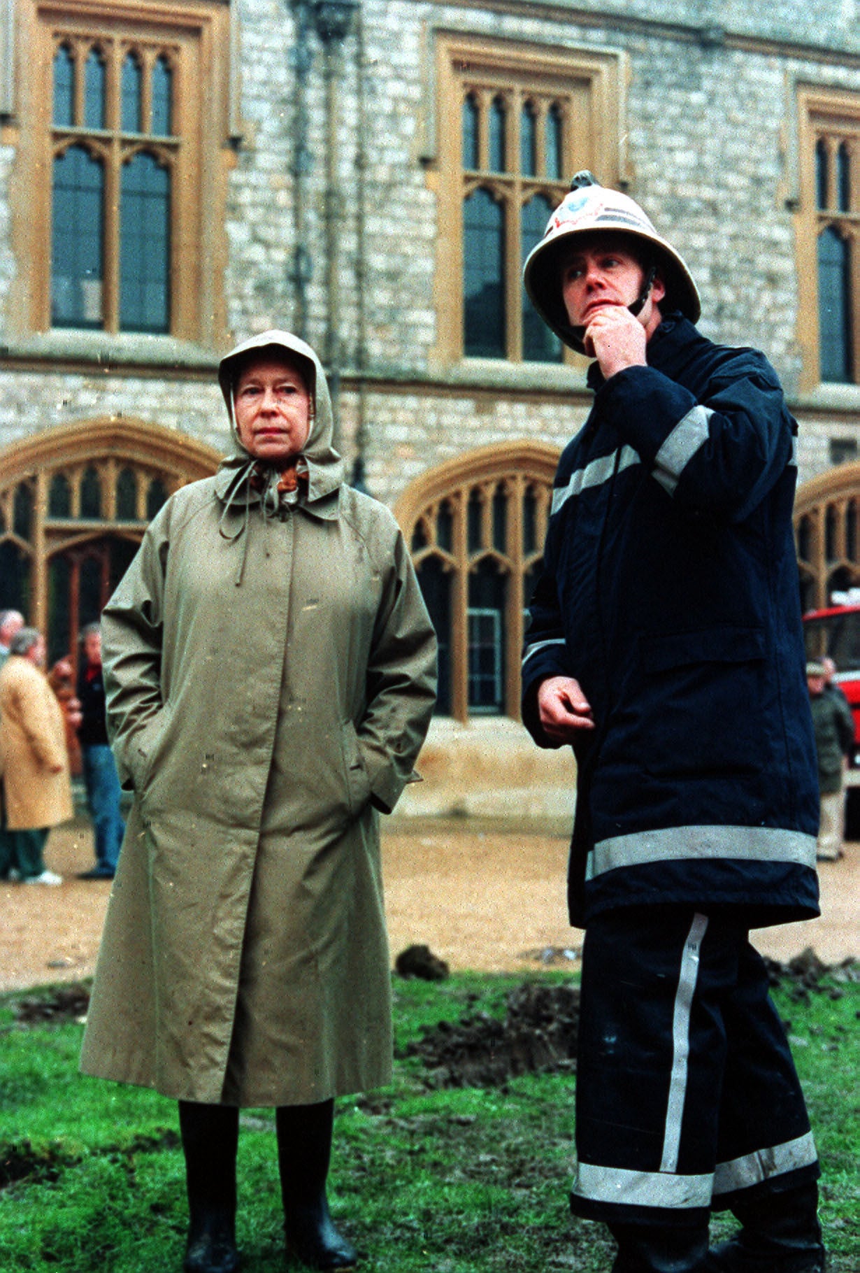 Queen Elizabeth II inspecting the damage to Windsor Castle in 1992