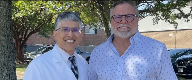Dr. Deepak Talreja (left) performed CPR for eight minutes after hearing a crash involving driver Jeff Geraci, who suffered a 'sudden cardiac death'