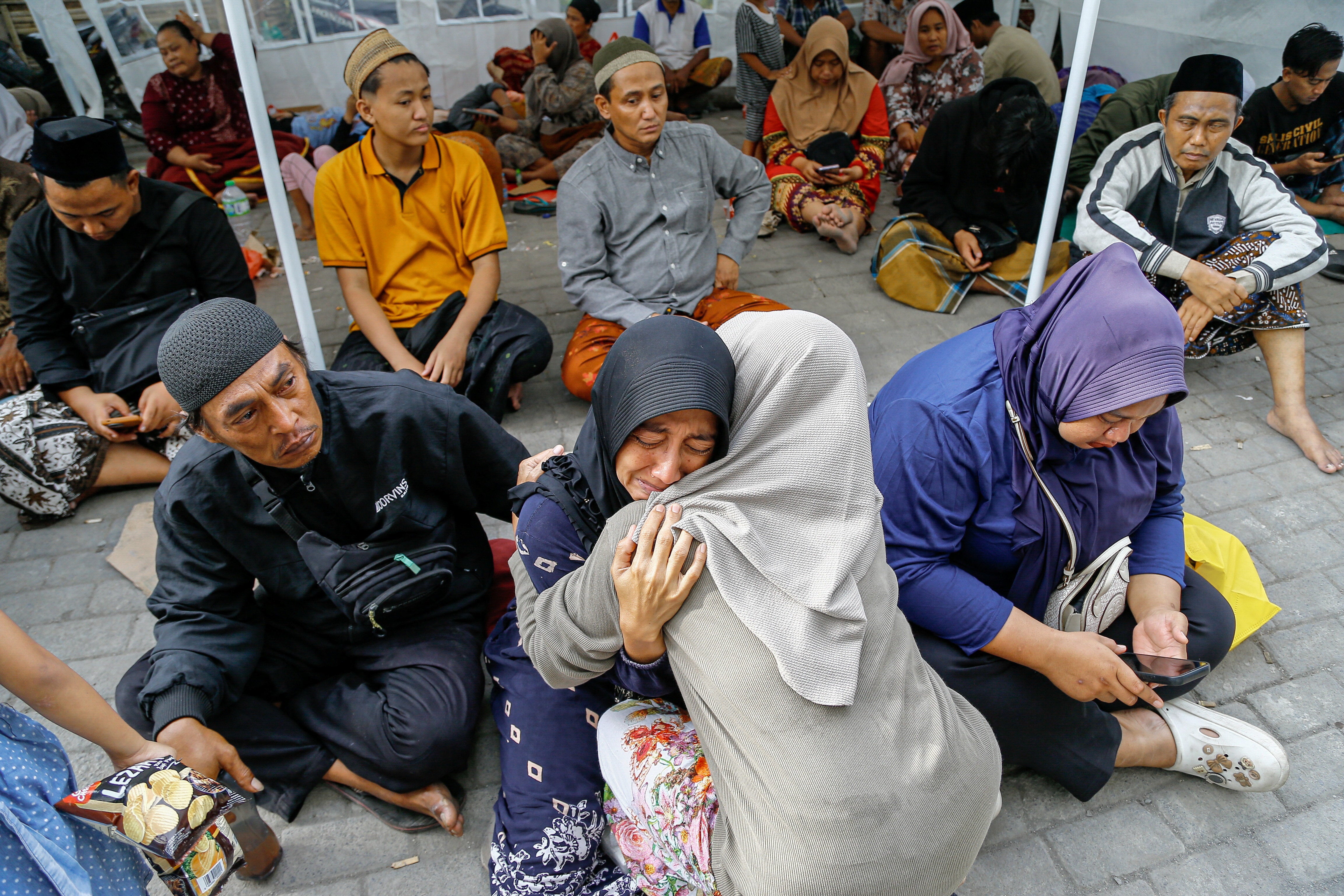 The relative of a victim reacts at al-Khoziny boarding school in Sidoarjo, East Java, Indonesia