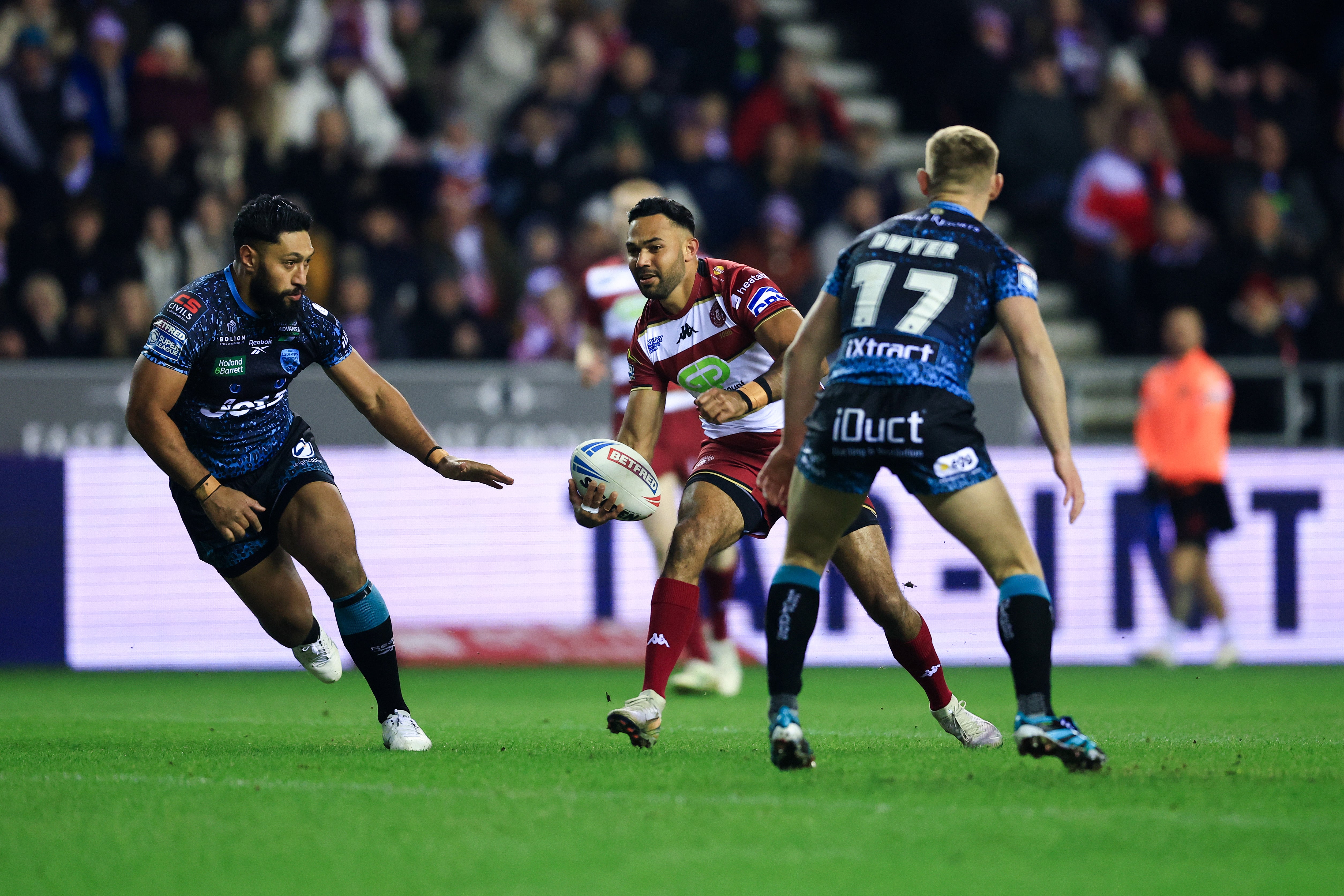 Bevan French of Wigan Warriors runs at the Leigh Leopards' defence during a Super League clash in February