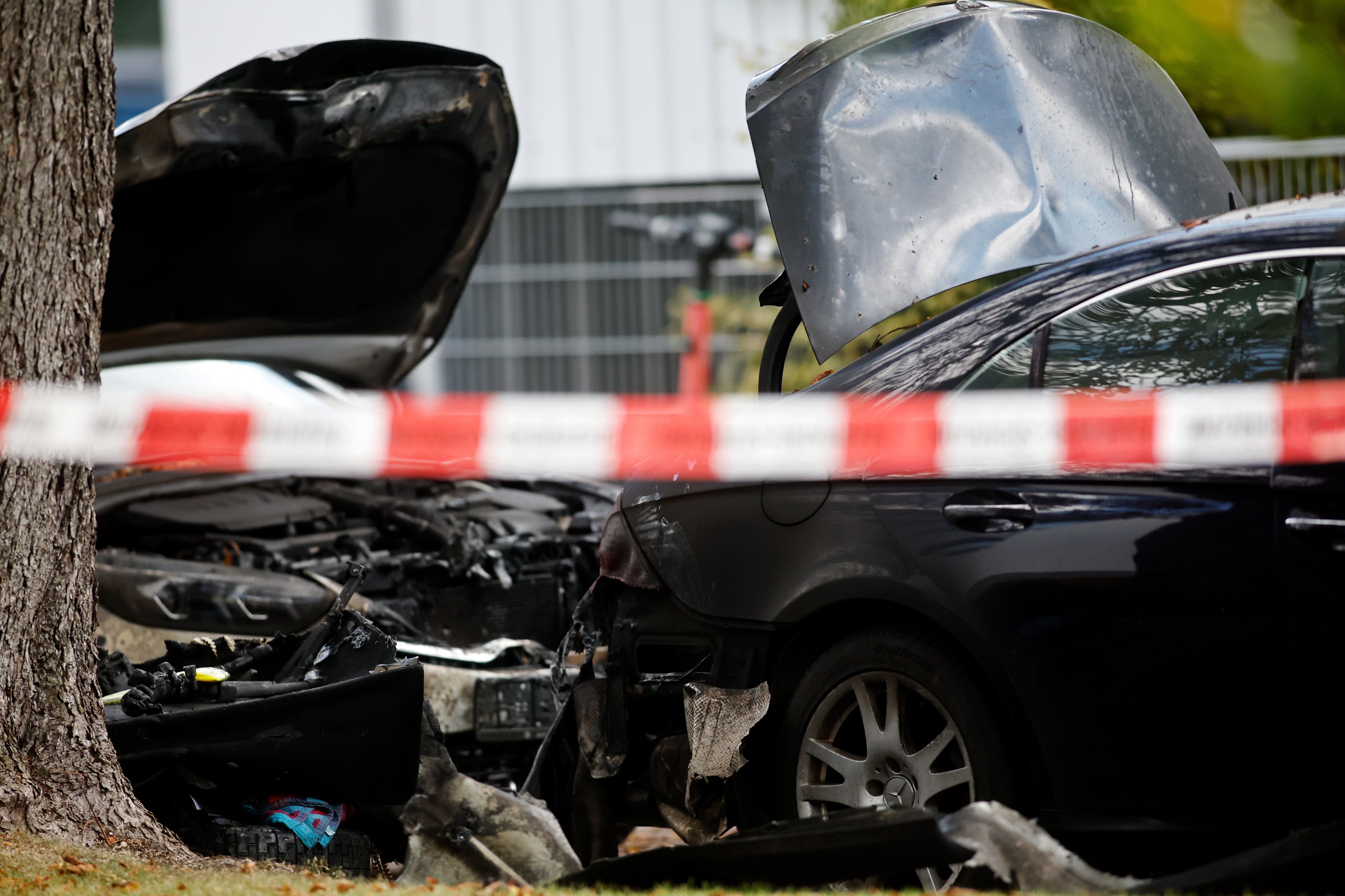The scene of a car fire close to the house fire reportedly set on purpose amid a domestic dispute in the Lerchenau area of Munich, Germany