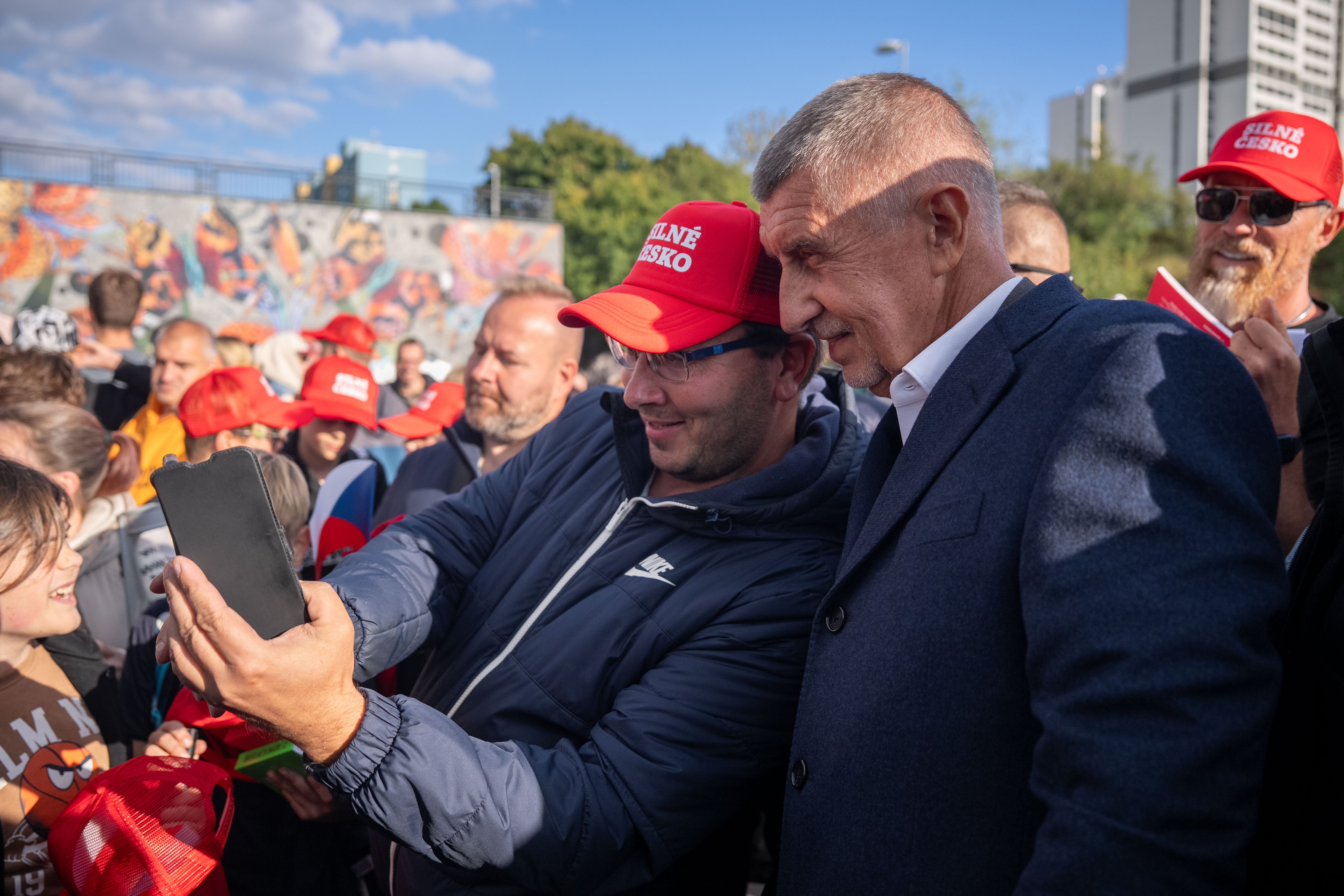 Babis poses for a photo with his supporter