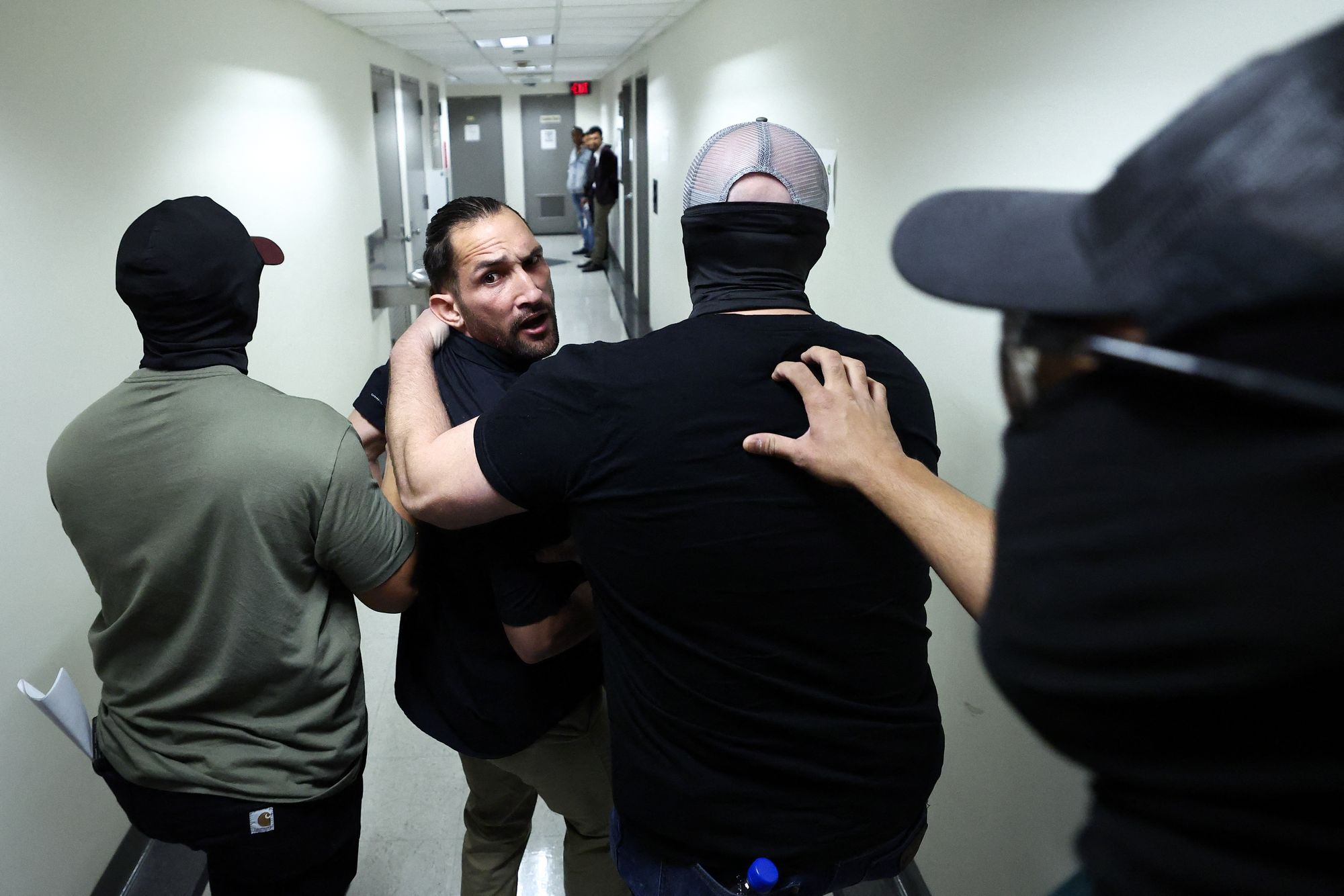 A man is detained by federal agents on October 1 after his hearing in an immigration court in New York City, where courthouse hallways have emerged as critical flashpoints for the Trump administration’s deportation plans, with officers ready to arrest immigrants moments after they leave their hearings